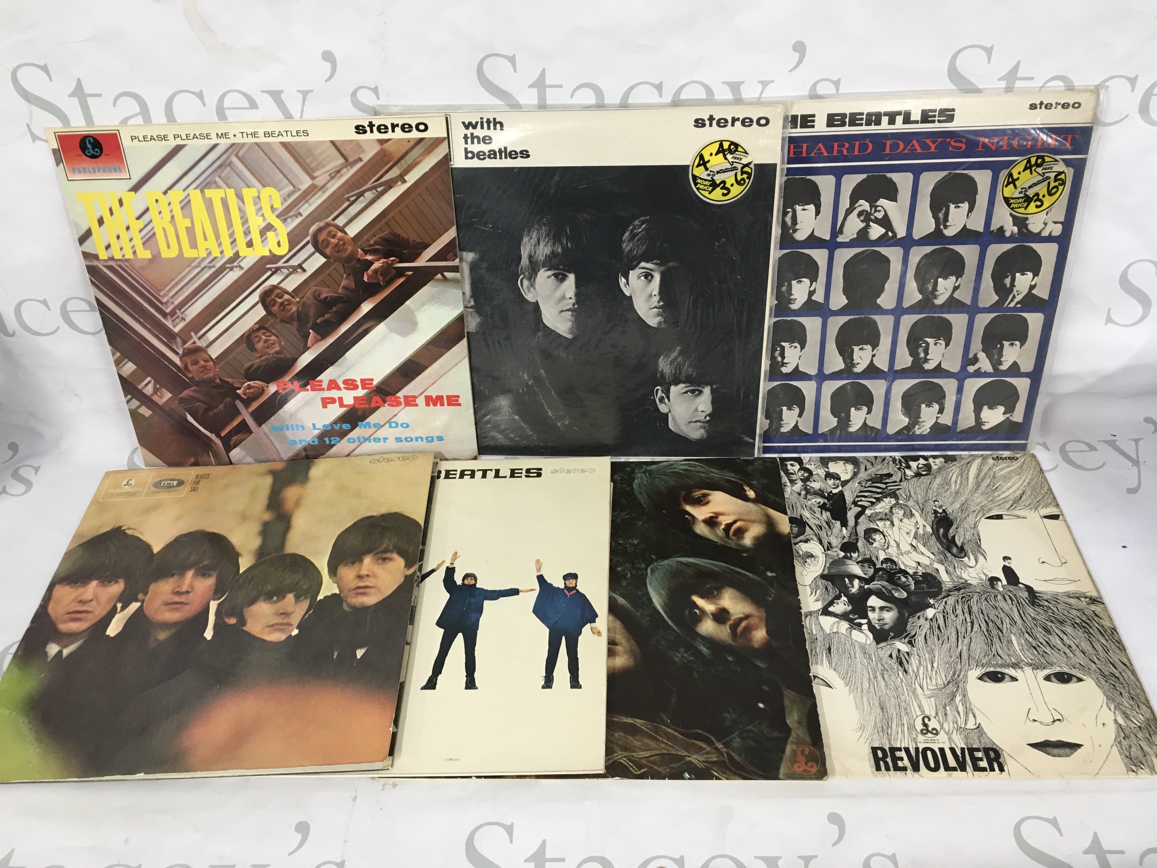 Fourteen Beatles LPs including original UK pressings and reissues. Please note all the early albums up to Rubber Soul are later repressings on black and silver Parlophone labels.