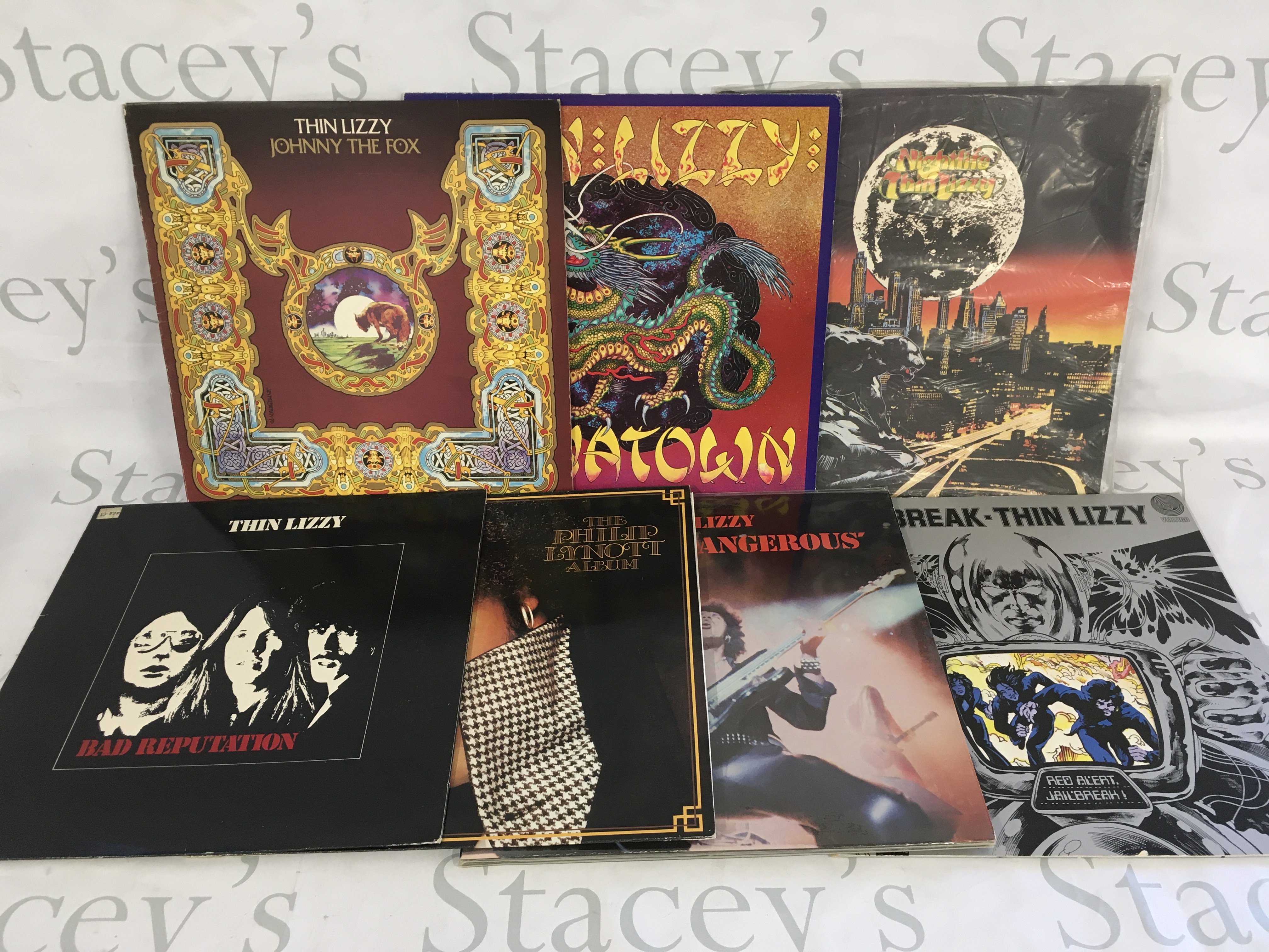 Seven Thin Lizzy and related LPs comprising Jailbreak, Bad Reputation and others.