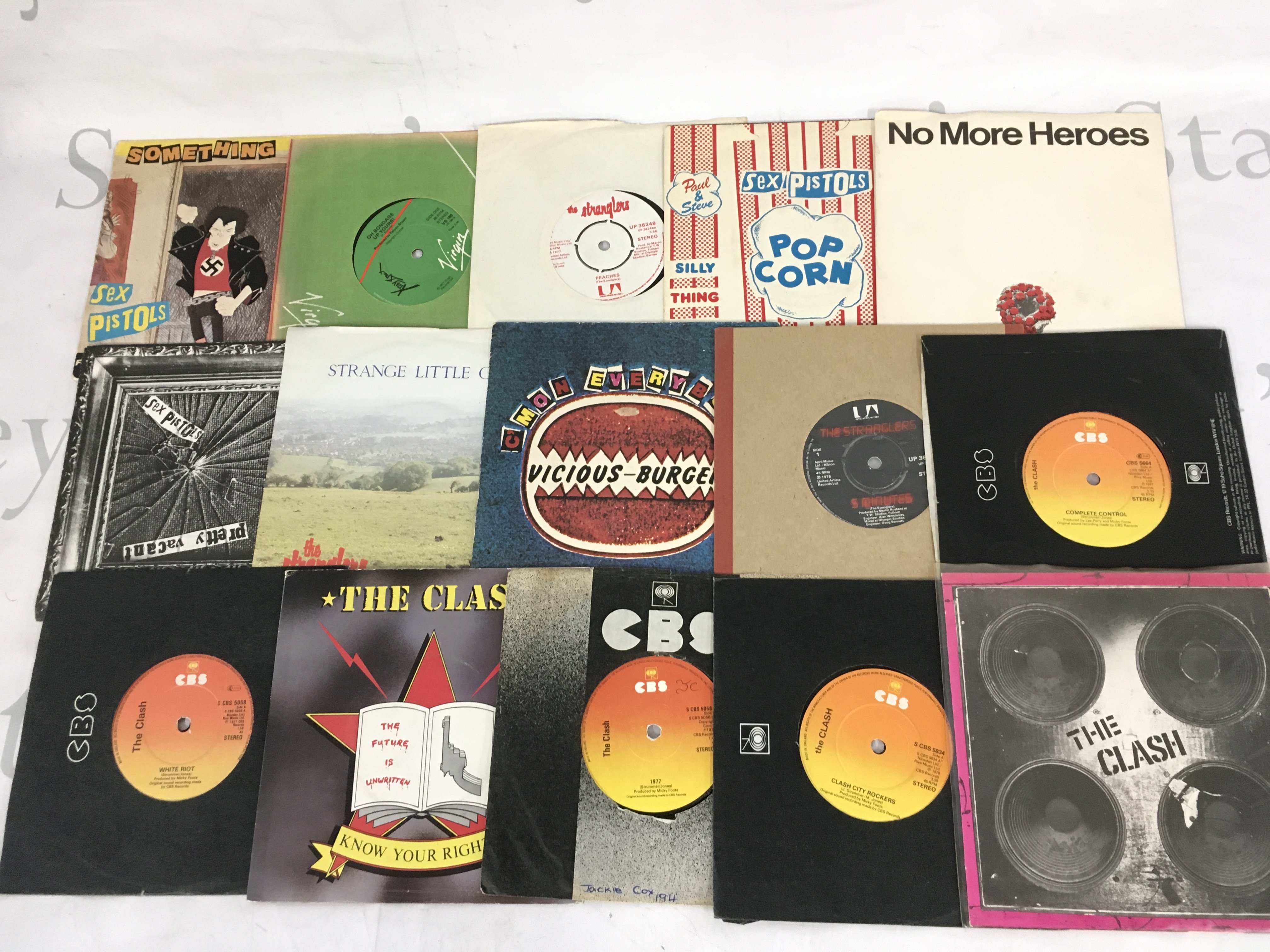 A collection of punk and post punk 7" singles by various artists including Sex Pistols, The Clash, The Stranglers, The Jam and others.