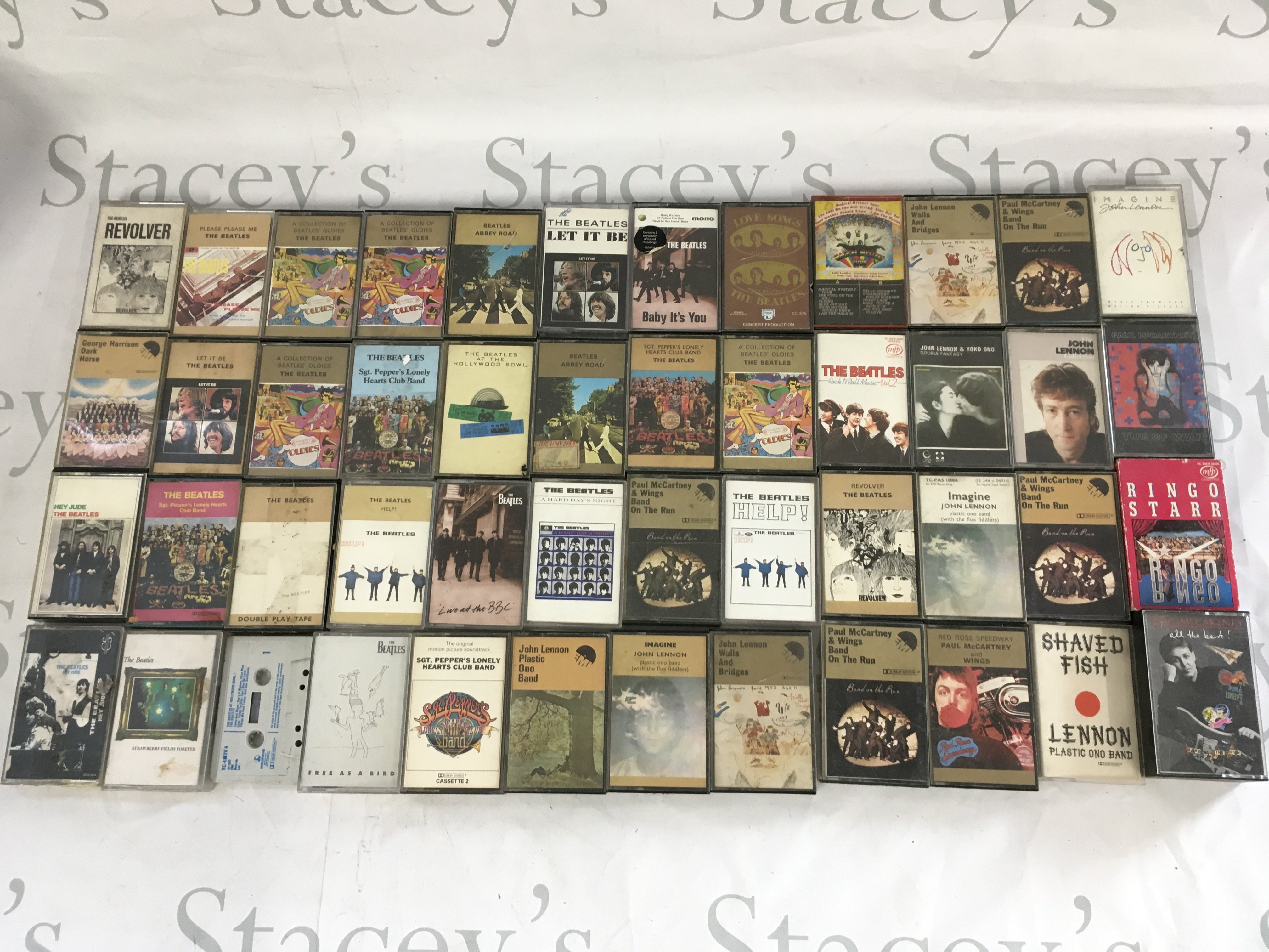 A collection of Beatles and related audio cassettes.