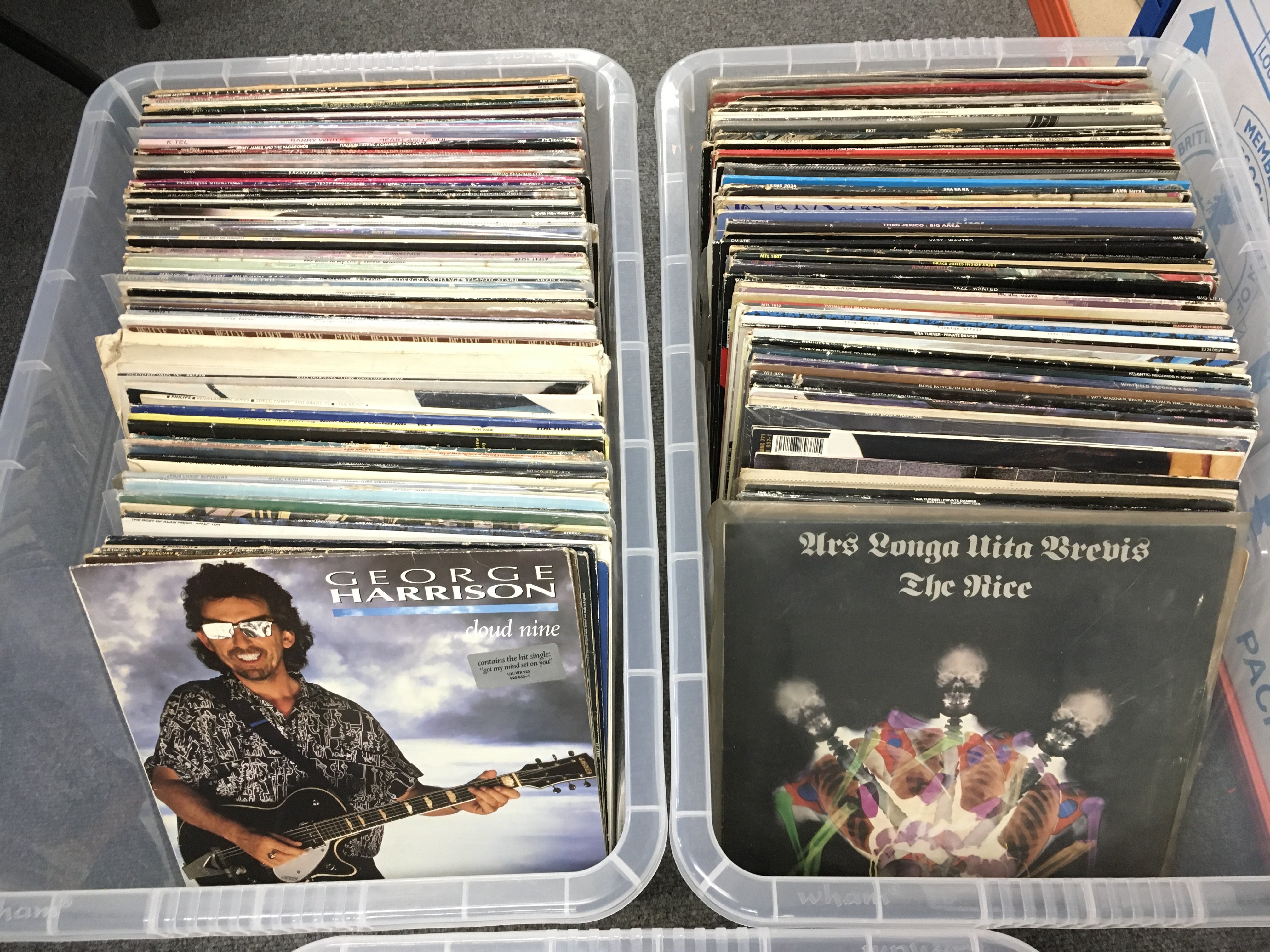 Three boxes of LPs and 12" singles by various artists including Paul McCartney, Kate Bush, Teddy Pendergrass and others plus a record case of album and 12" record sleeves.