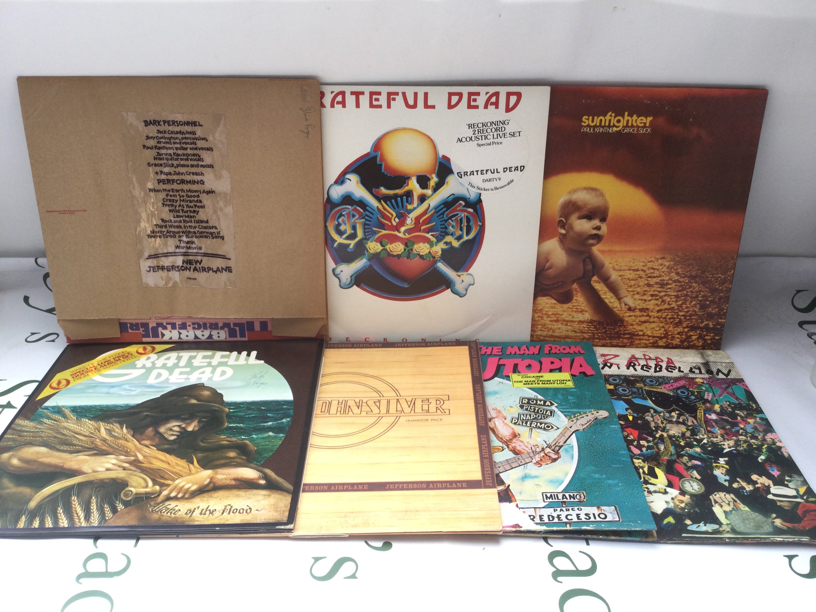 Seven rock LPs by The Grateful Dead, Jefferson Airplane and others. Includes a Frank Zappa promo disc.