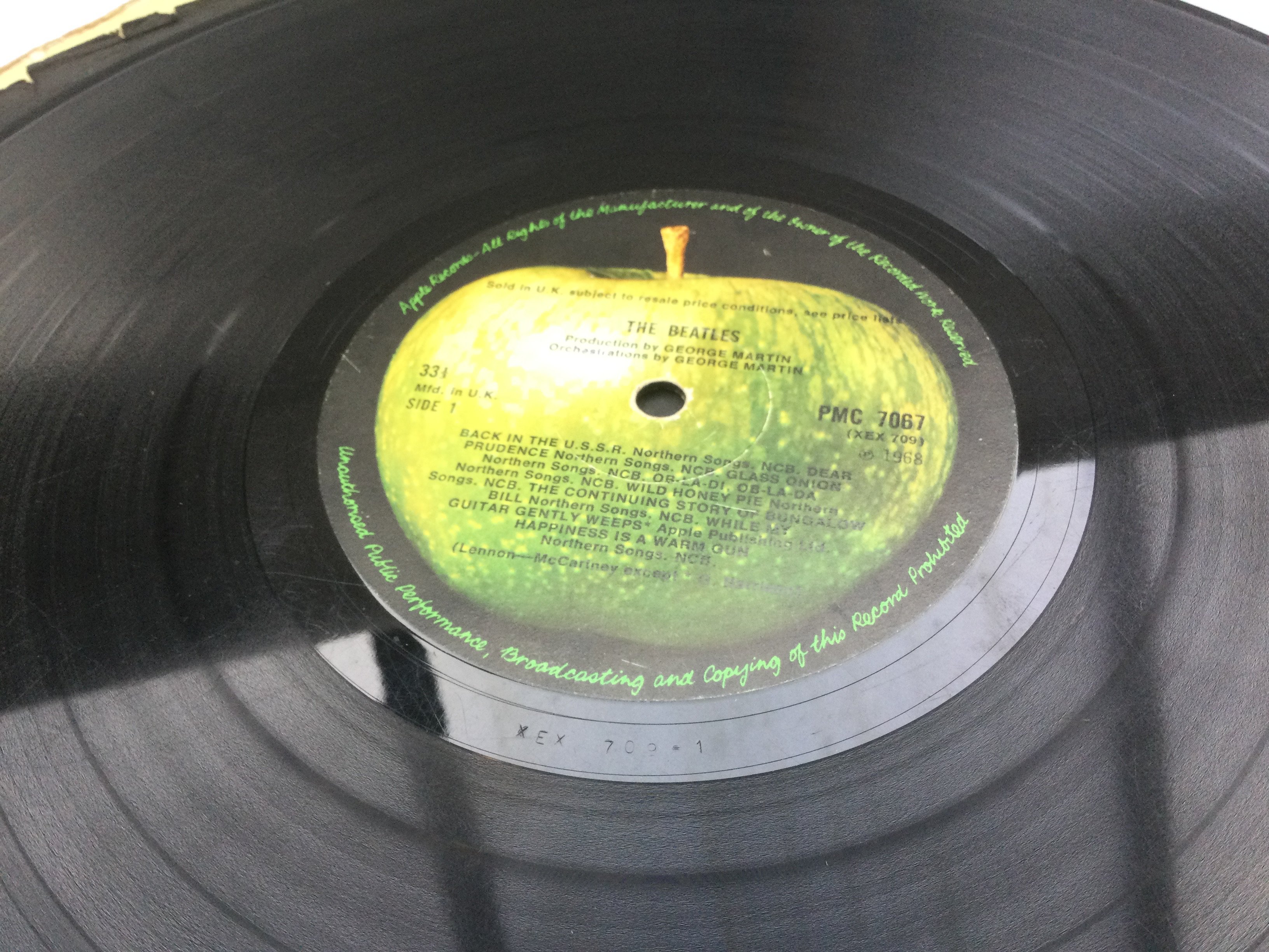 Two Beatles LPs comprising a numbered 'White Album' 0125304 and a US pressing of 'Magical Mystery Tour'. Both discs of the 'White Album' are sadly scratched and is lacking poster.