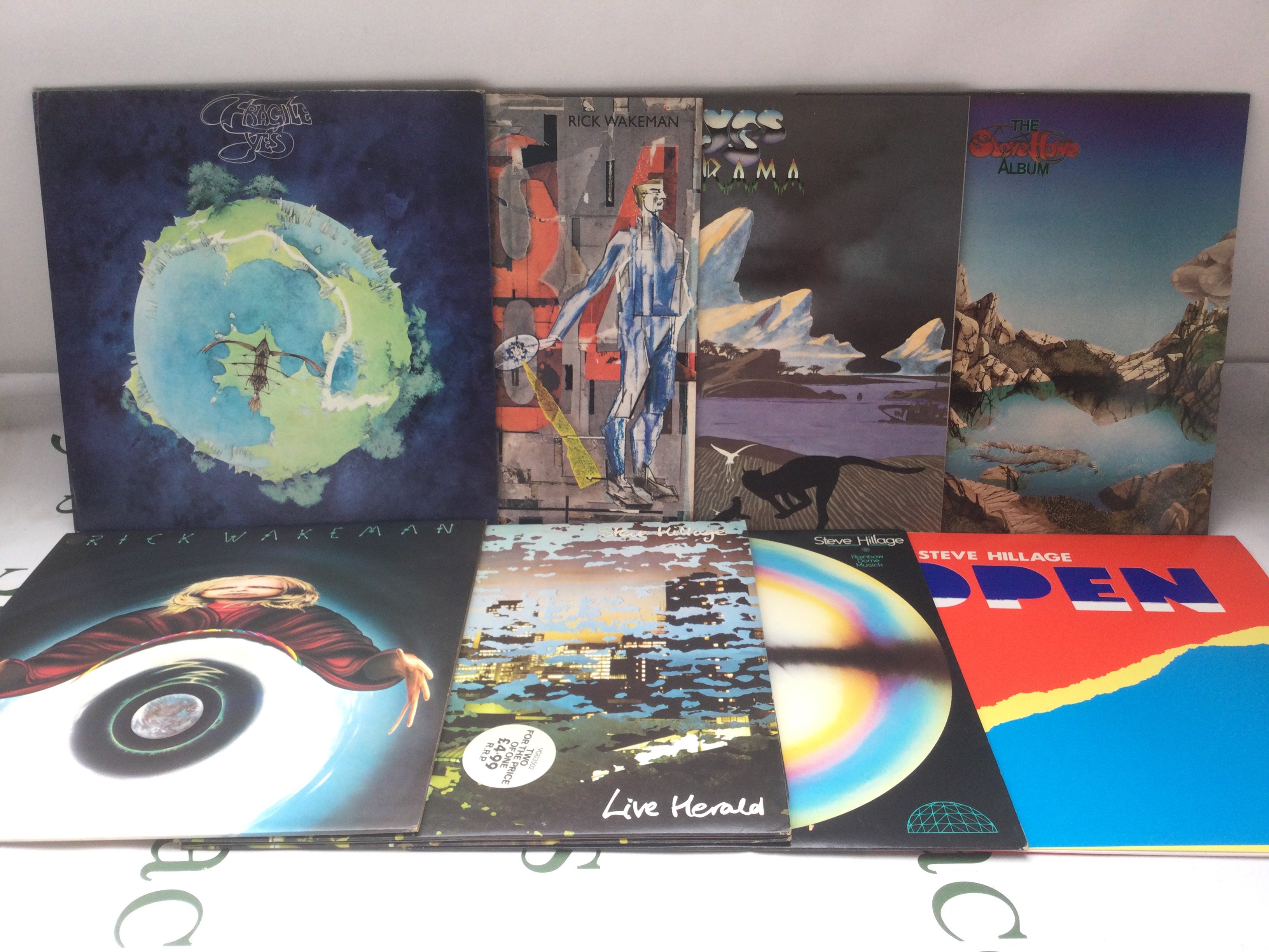 Two bags containing sixteen Yes and related LPs. Includes two promo discs.