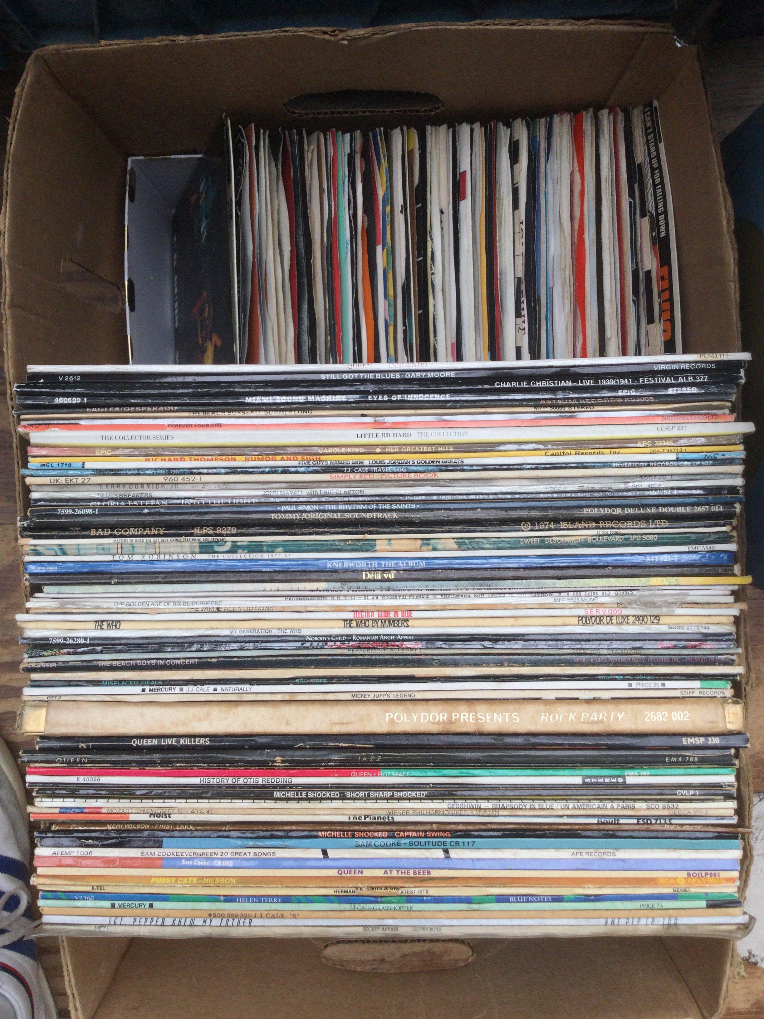 A box of LPs and 7" singles by various artists including Queen UK Subs, The Who and many more.