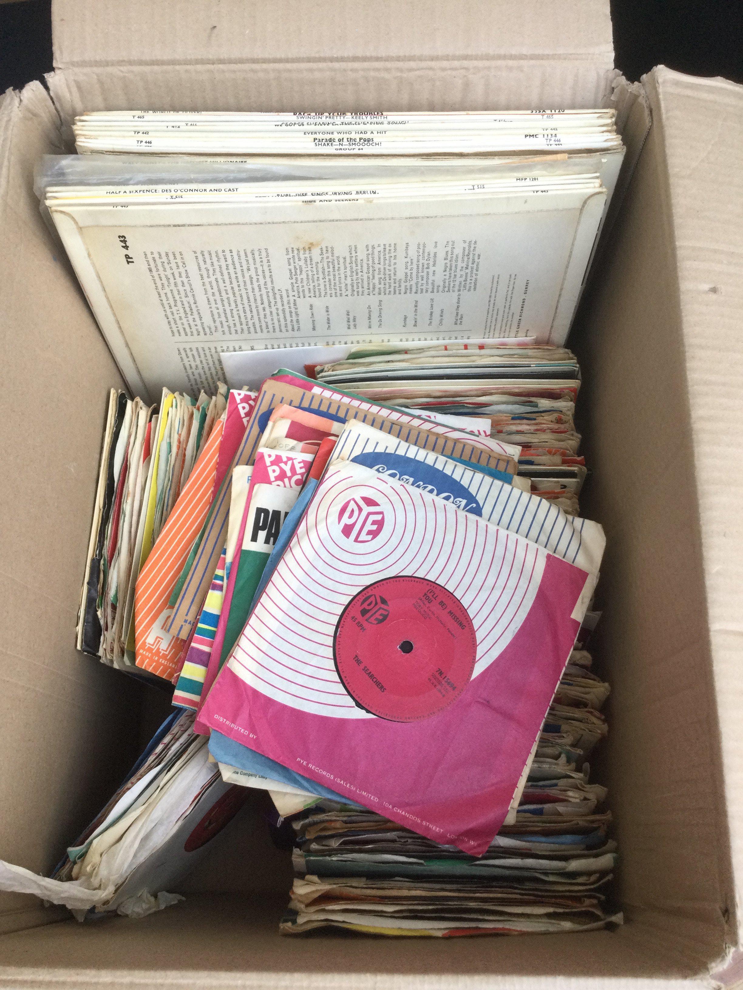 A box of 7" singles, EPs and LPs by various artists including Elvis Presley, The Yardbirds, The Kinks and many more.