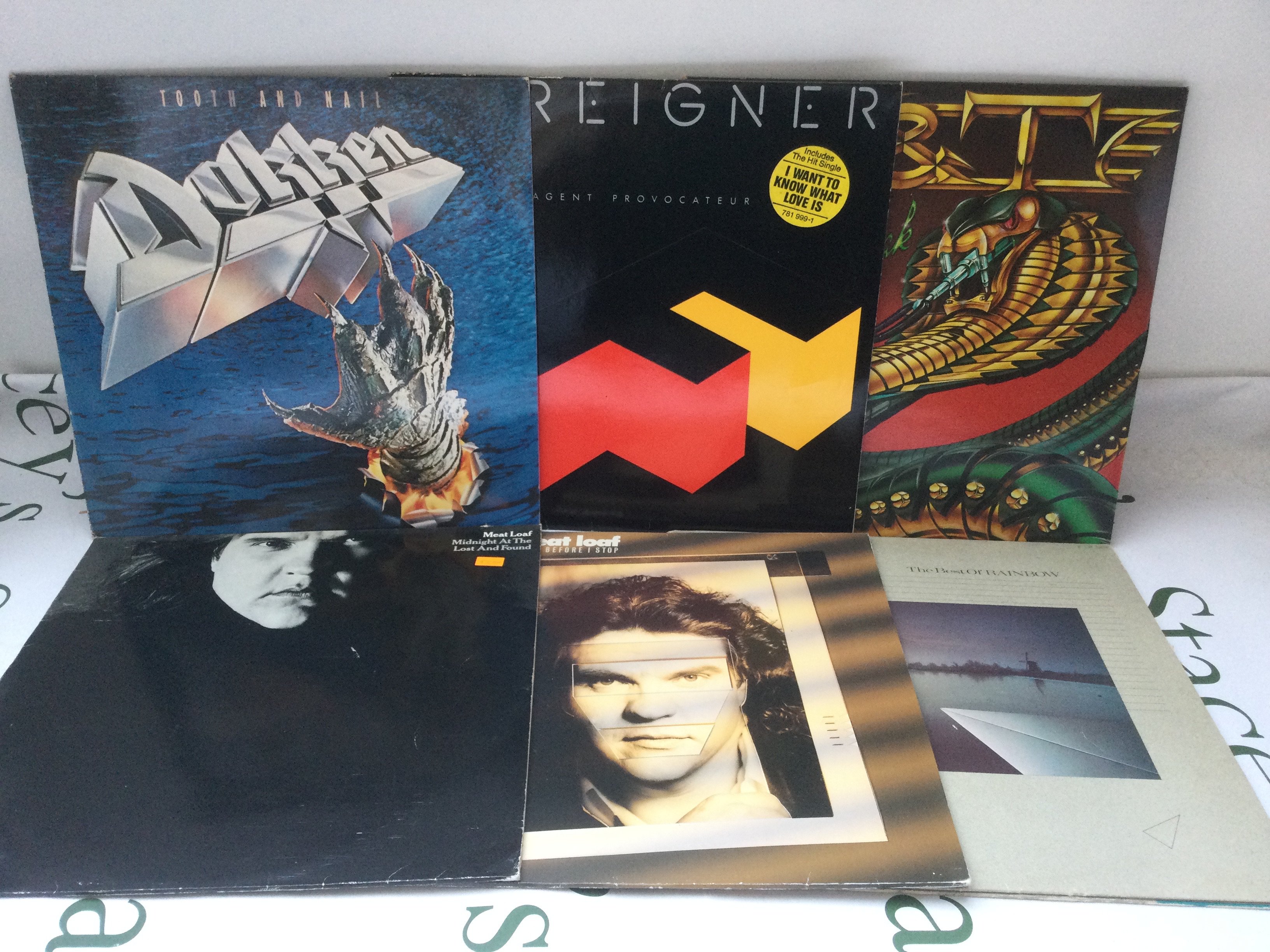 Thirteen rock LPs and a 12" picture disc single by various artists including Queen, Styx and others.