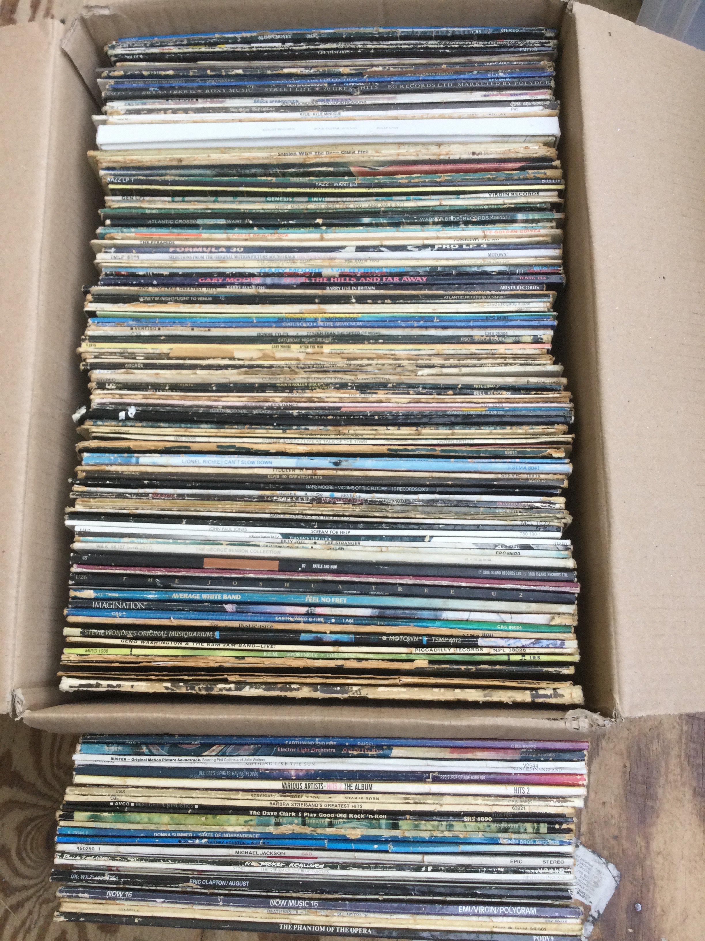 A box and a bag of LPs and 12" singles by various artists including Pink Floyd, The Rolling Stones, REM and many more.