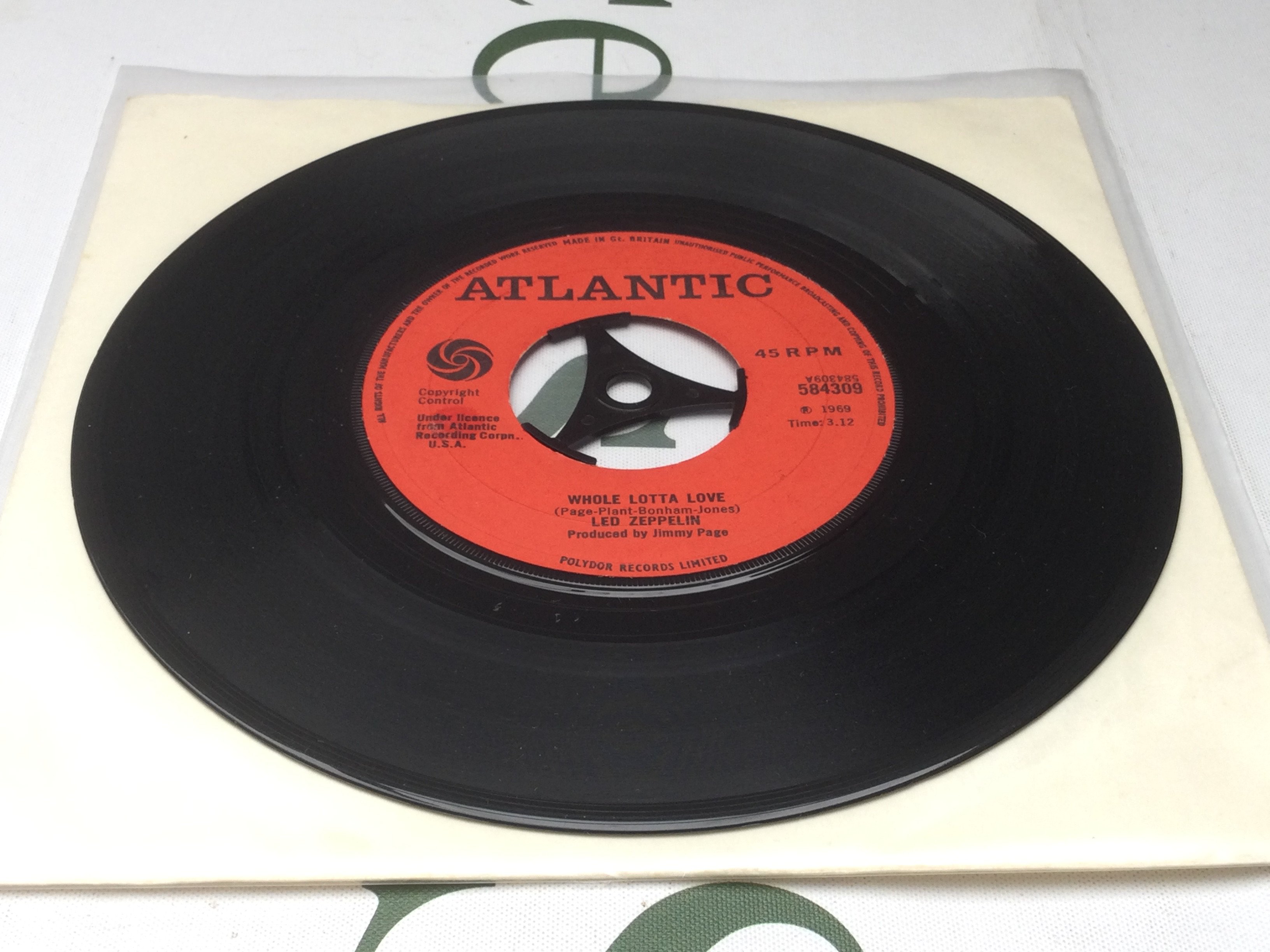 A very rare 7" pressing of the Led Zeppelin single 'Whole Lotta Love'. It was withdrawn before it was put into sale because the band and the label couldn't find an agreement over the release. Only a few hundred copies were somehow "leaked" to public, rumours say, from a warehouse in Manchester. Matrix 584309. Condition Ex.