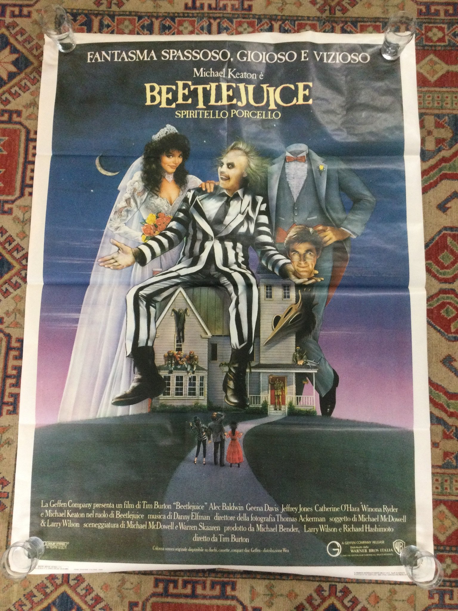 An Italian film poster for Beetlejuice, rolled with a tear at the top. Approx 140cm x 100cm.