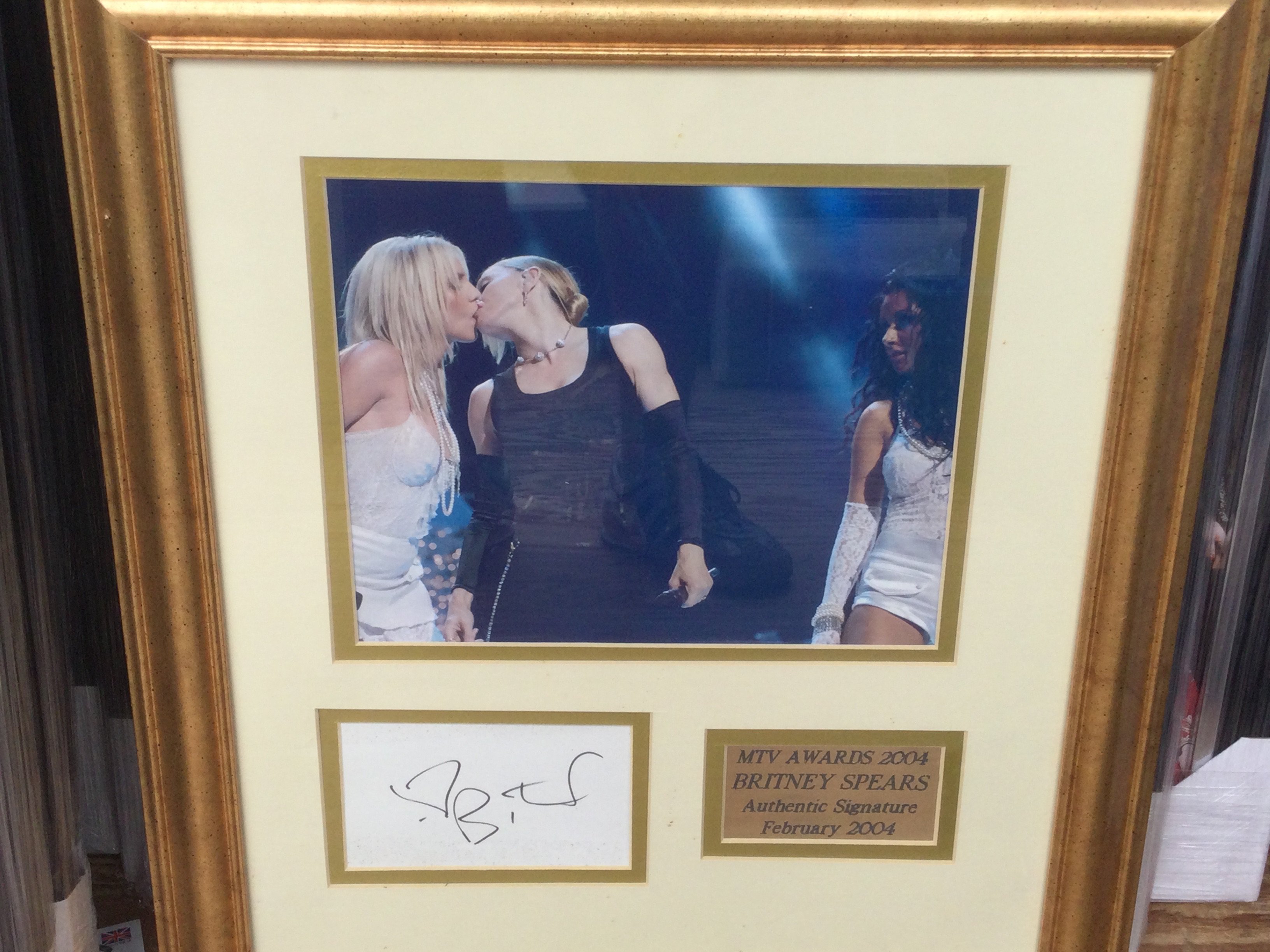 A framed and glazed signed Britney Spears display, approx 48cm x 43cm.