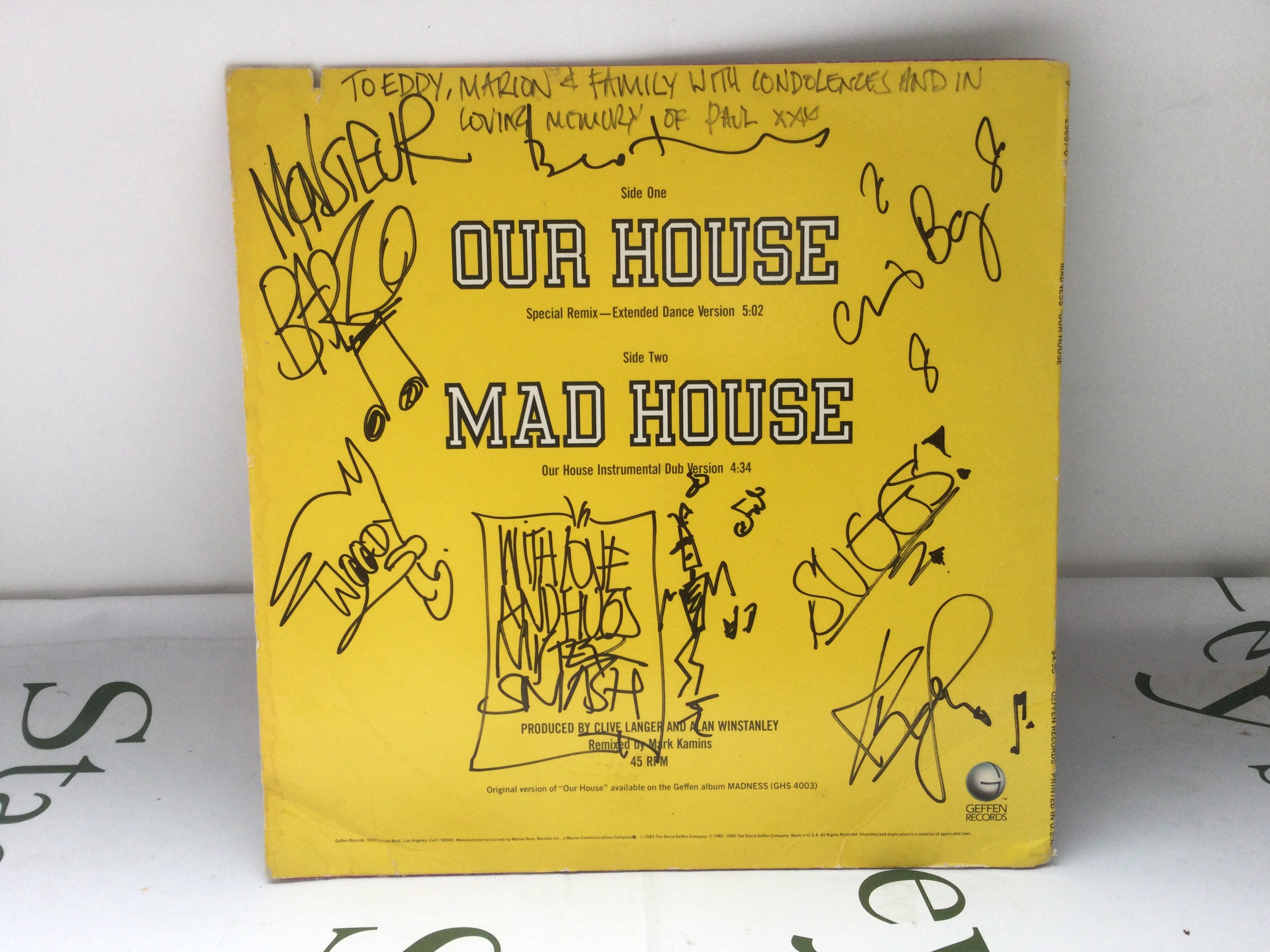 A signed Madness 12" single of Our House.
