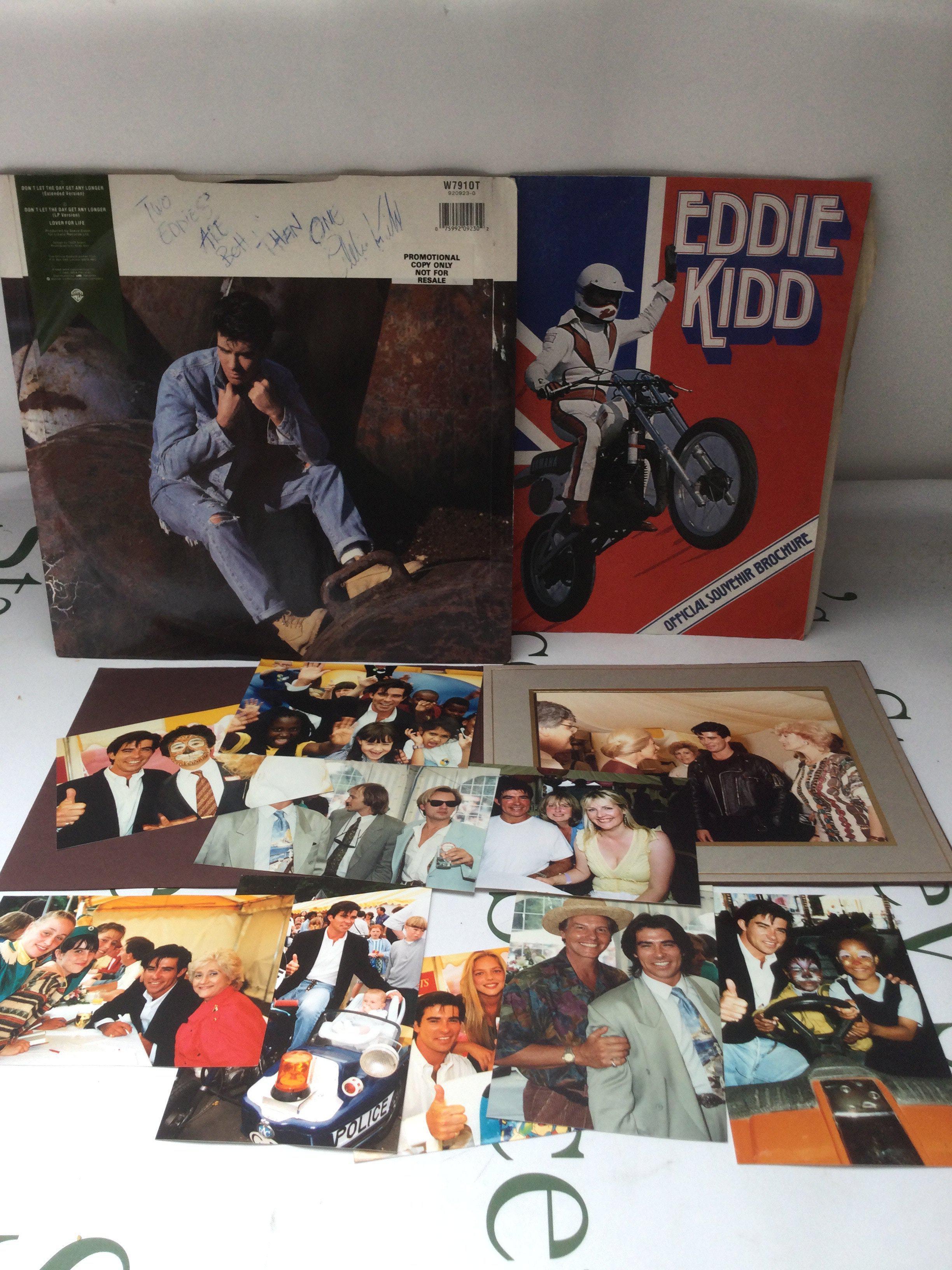 An Eddie Kidd signed 12" single, souvenir brochure and various photographs.