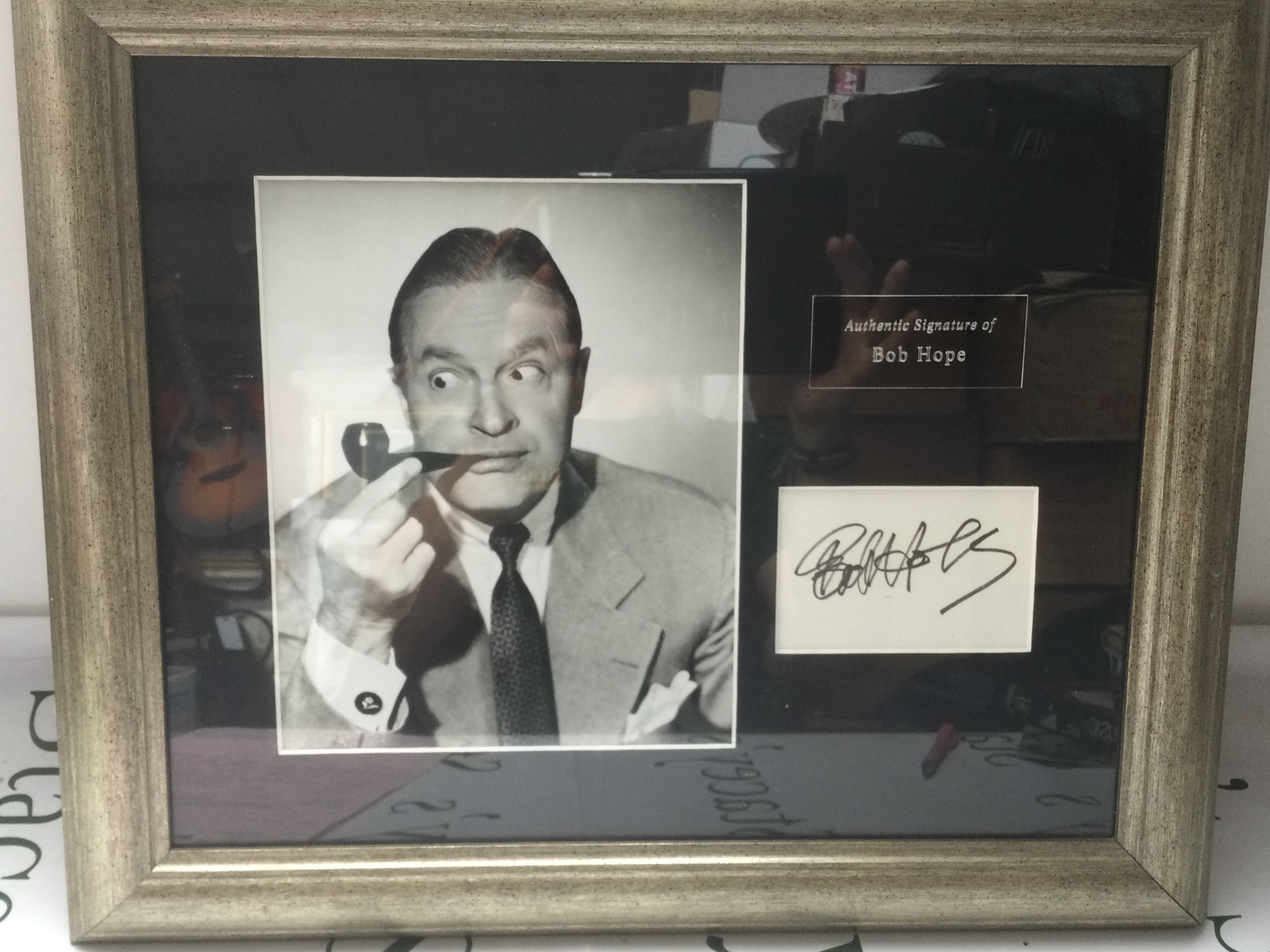 A framed and glazed signed Bob Hope display with COA, approx 51cm x 43cm.