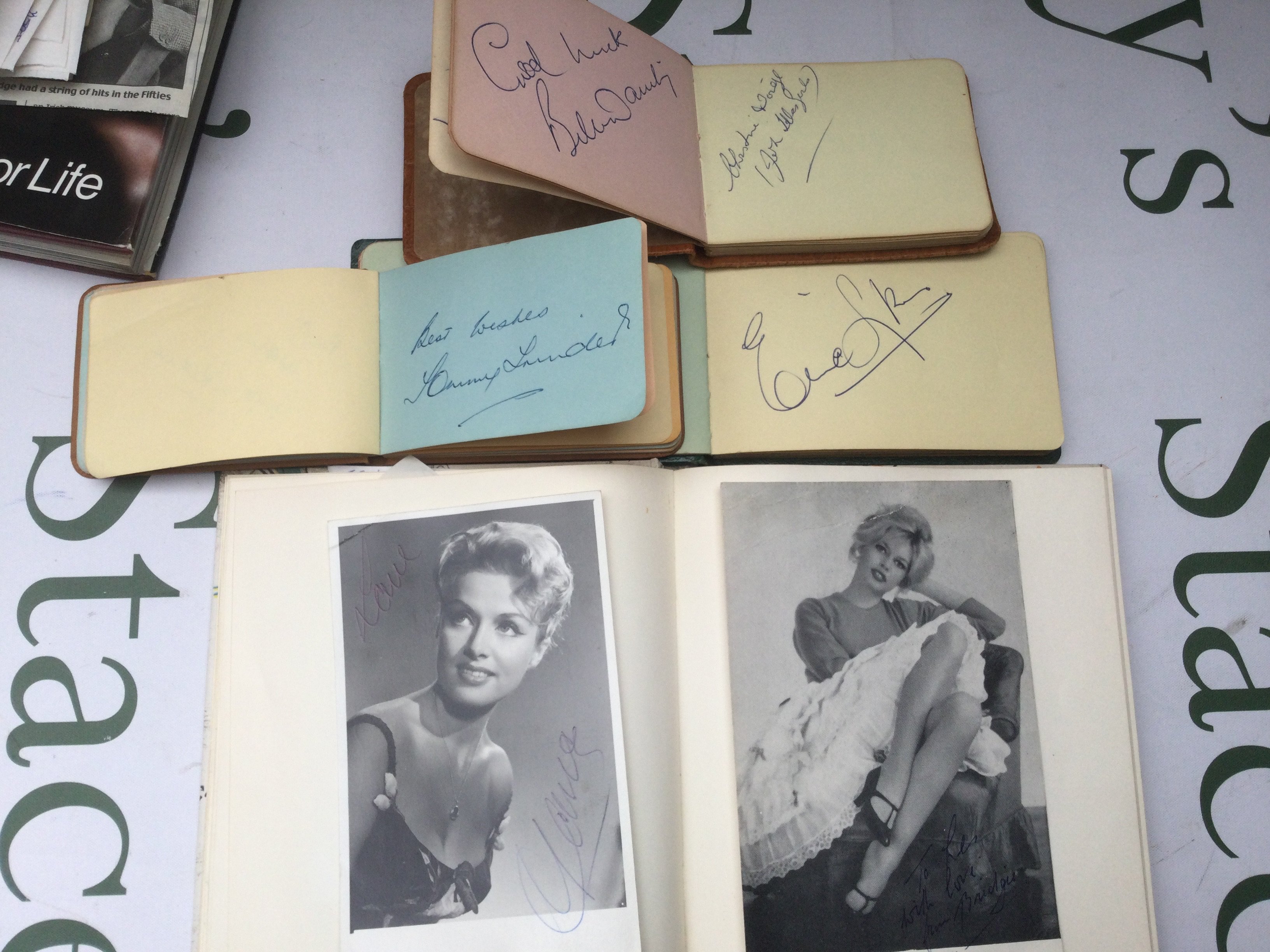 A collection of autographs including Sid James, Harry H Corbett, Marty Wilde and many more plus some early promo cards for musical acts including The Beatles, The Shadows, Billy Fury and others.