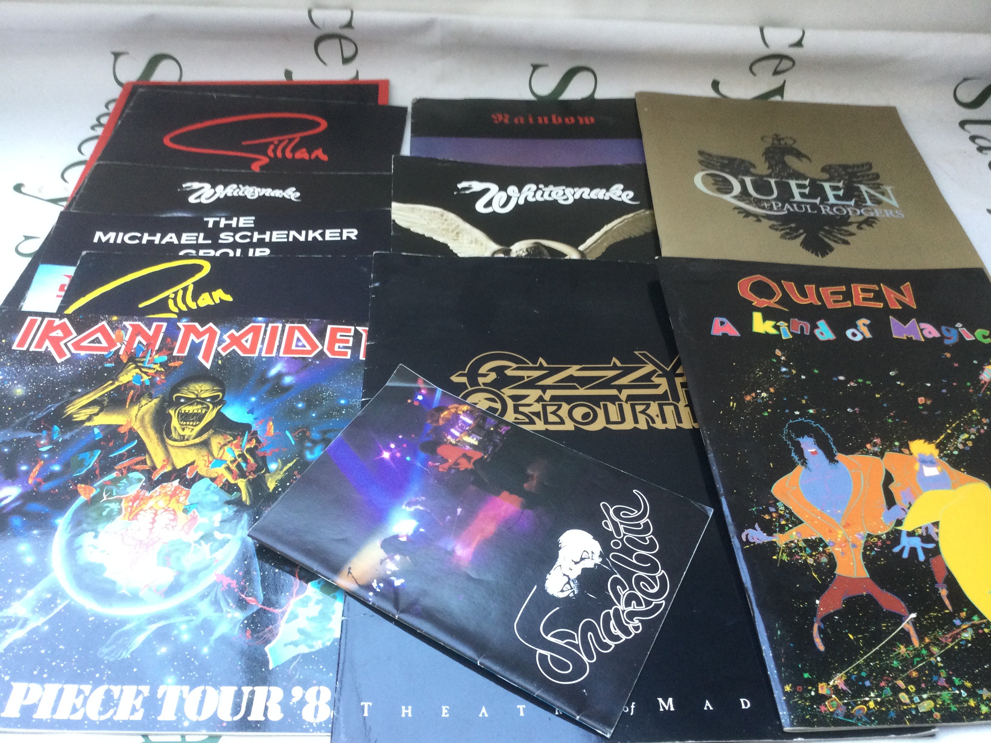 A collection of rock music programs, some with tickets. Artists include Iron Maiden, Queen, Gillan and others.
