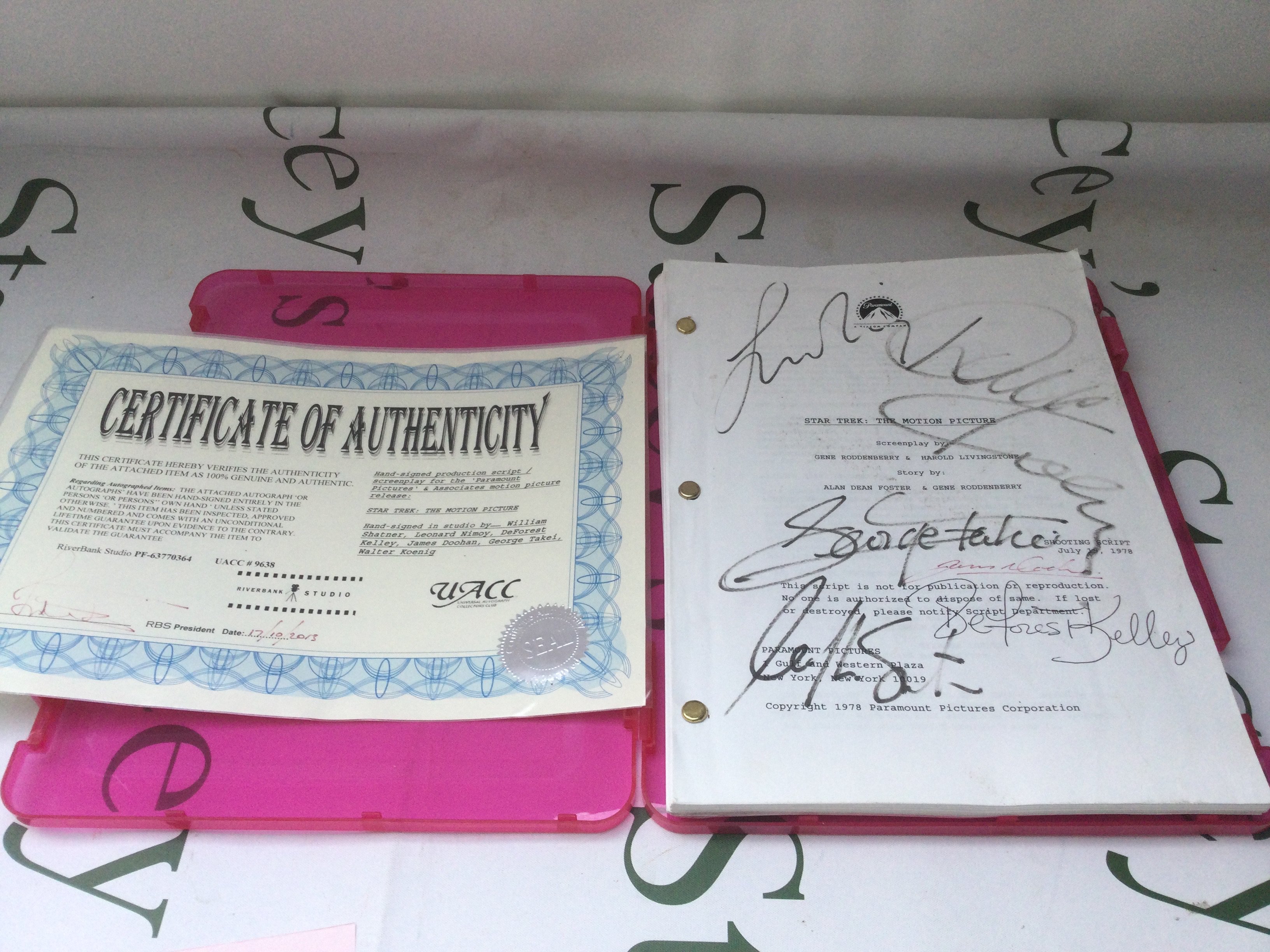 A multi signed film script for Star Trek The Motion Picture signed by William Shatner, Leonard Nimoy, DeForest Kelley, James Doohan, George Takei and Walter Koenig. Comes with COA.