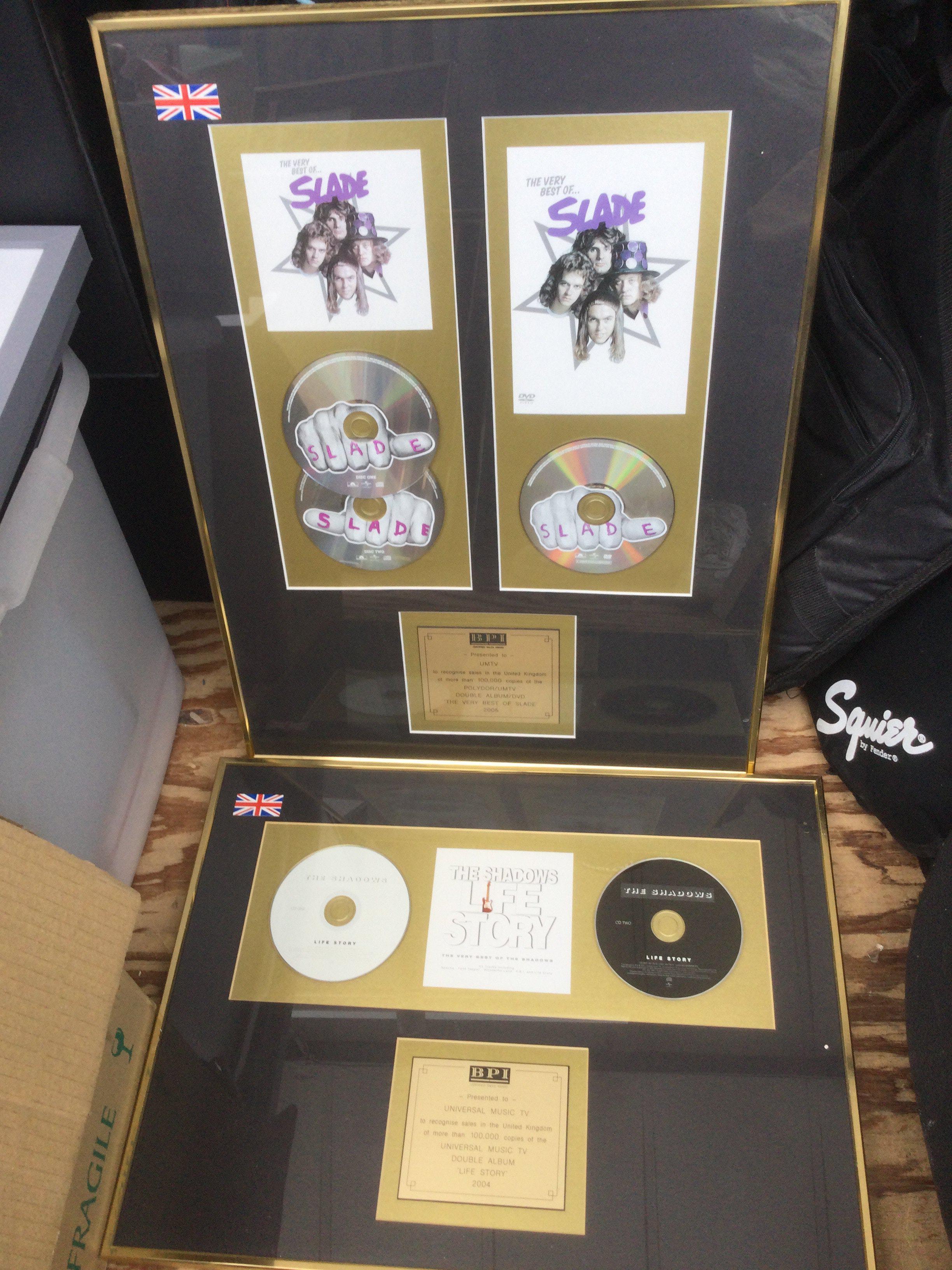 Four framed and glazed CD displays for various artists including Slade, The Shadows, Lionel Richie and David Cassidy.