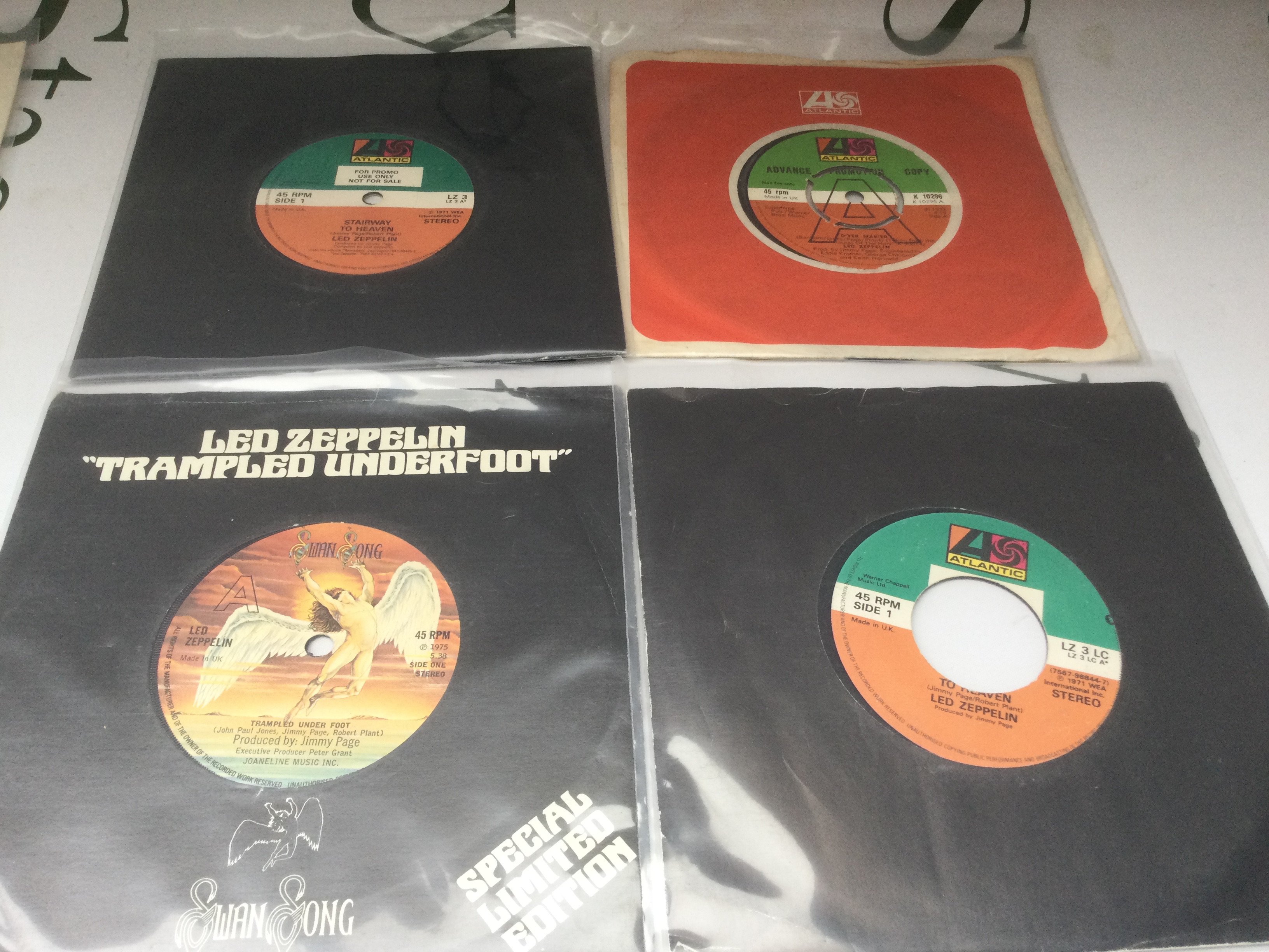Four Led Zeppelin 7" singles comprising a 1 of only 150 promo discs cut for Stairway To Heaven / Whole Lotta Love together with a letter of provenance. Condition on all is Ex.