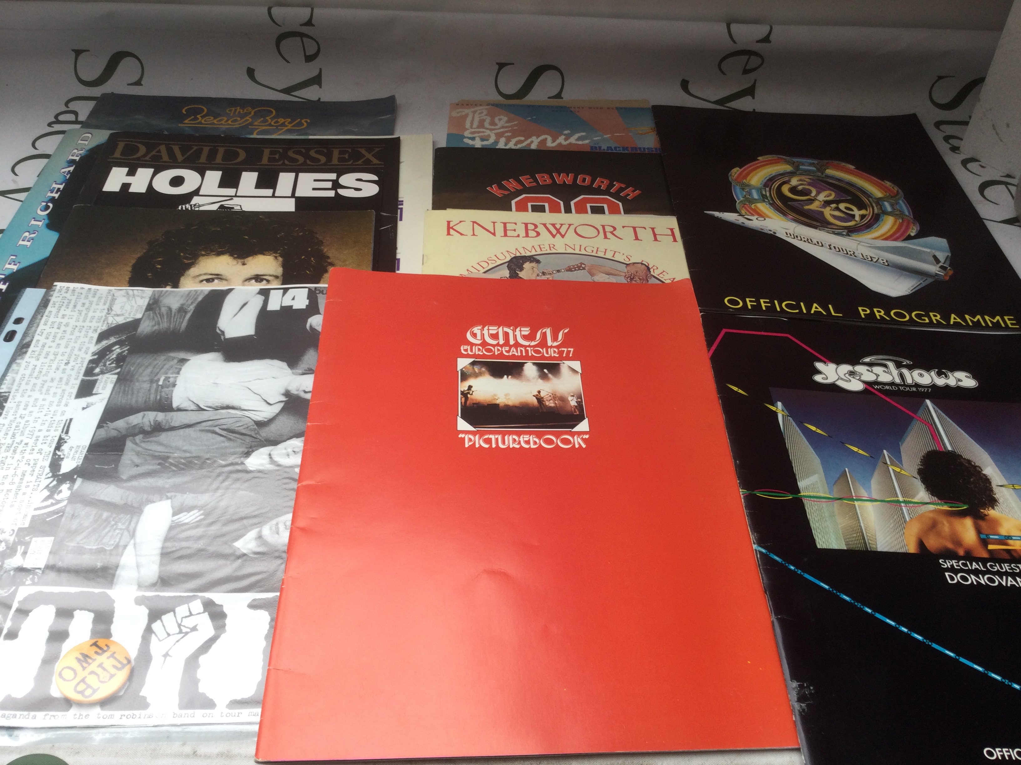 A collection of music programs, most with tickets, for shows by various artists including Genesis, ELO, Yes and others plus various ephemera.