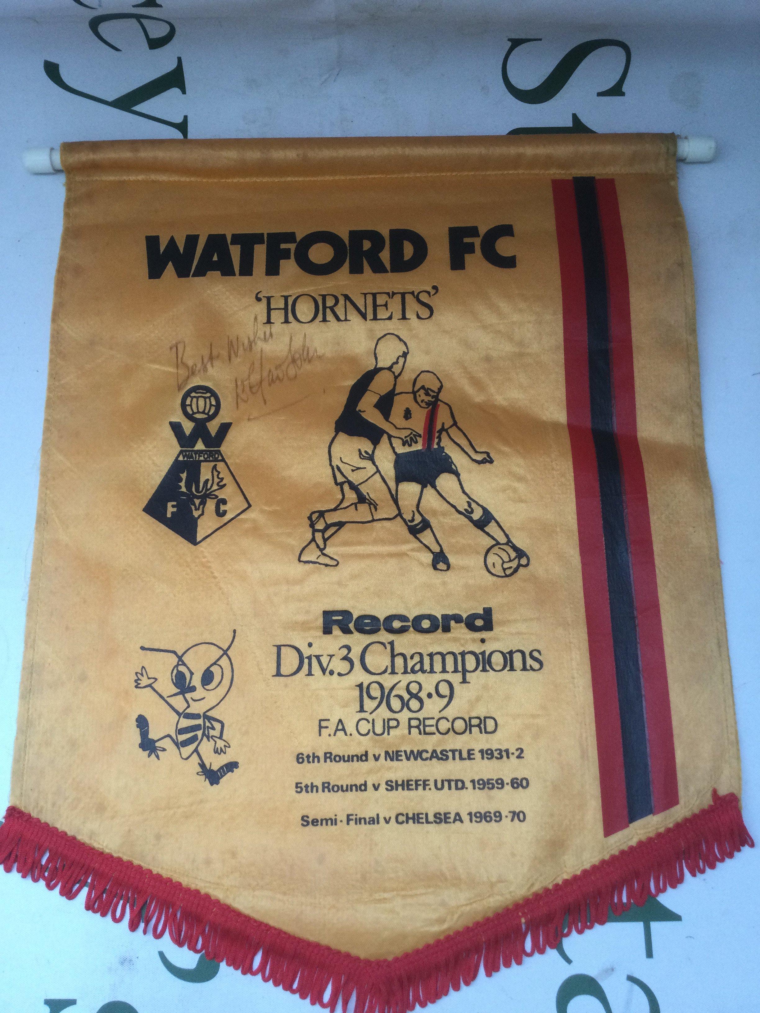 An Elton John signed Watford FC pendant.