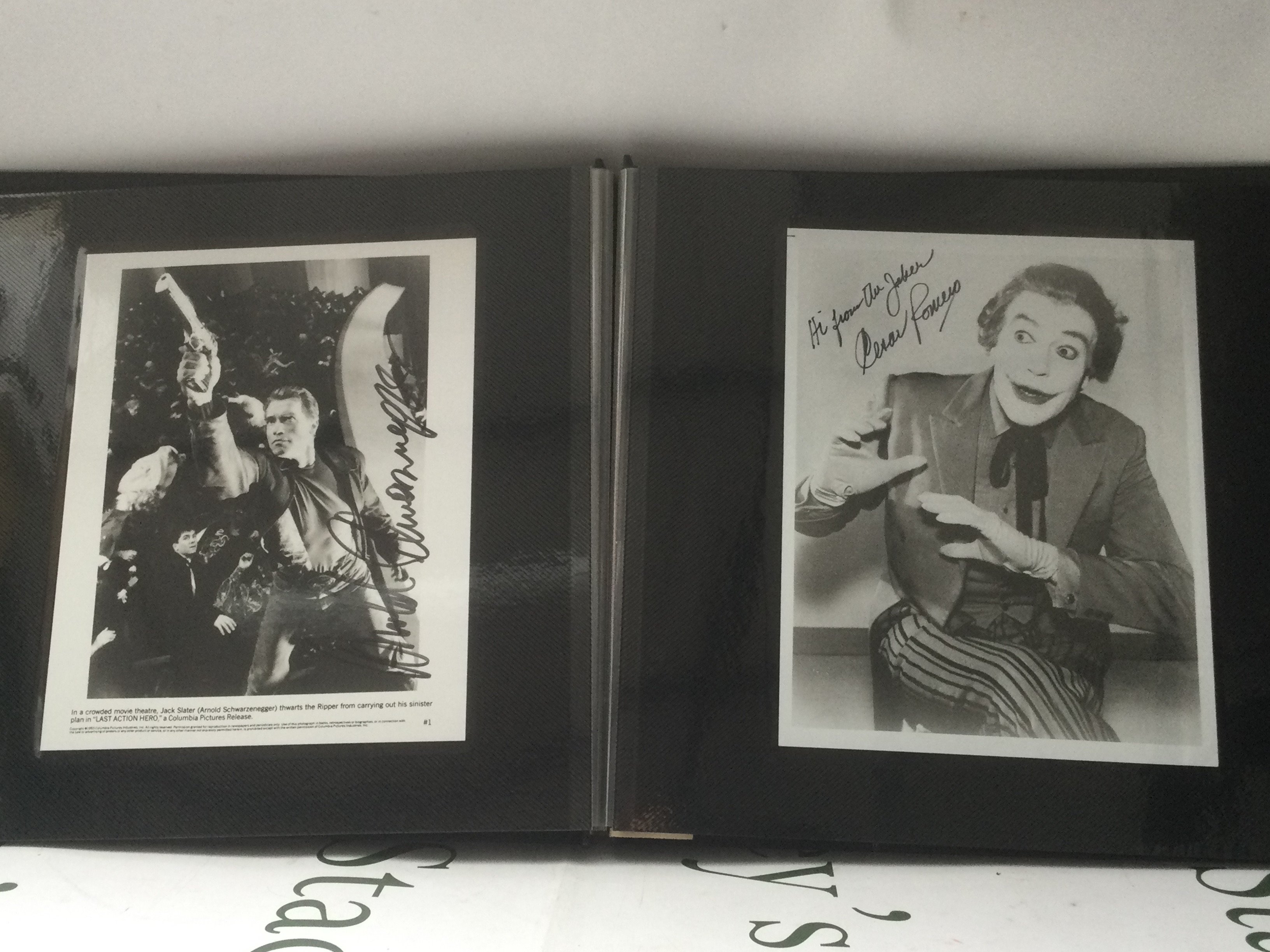 A binder of signed photos comprising Cesar Romero, Jimmy Stewart, Roy Rogers, Kirk Douglas and others.