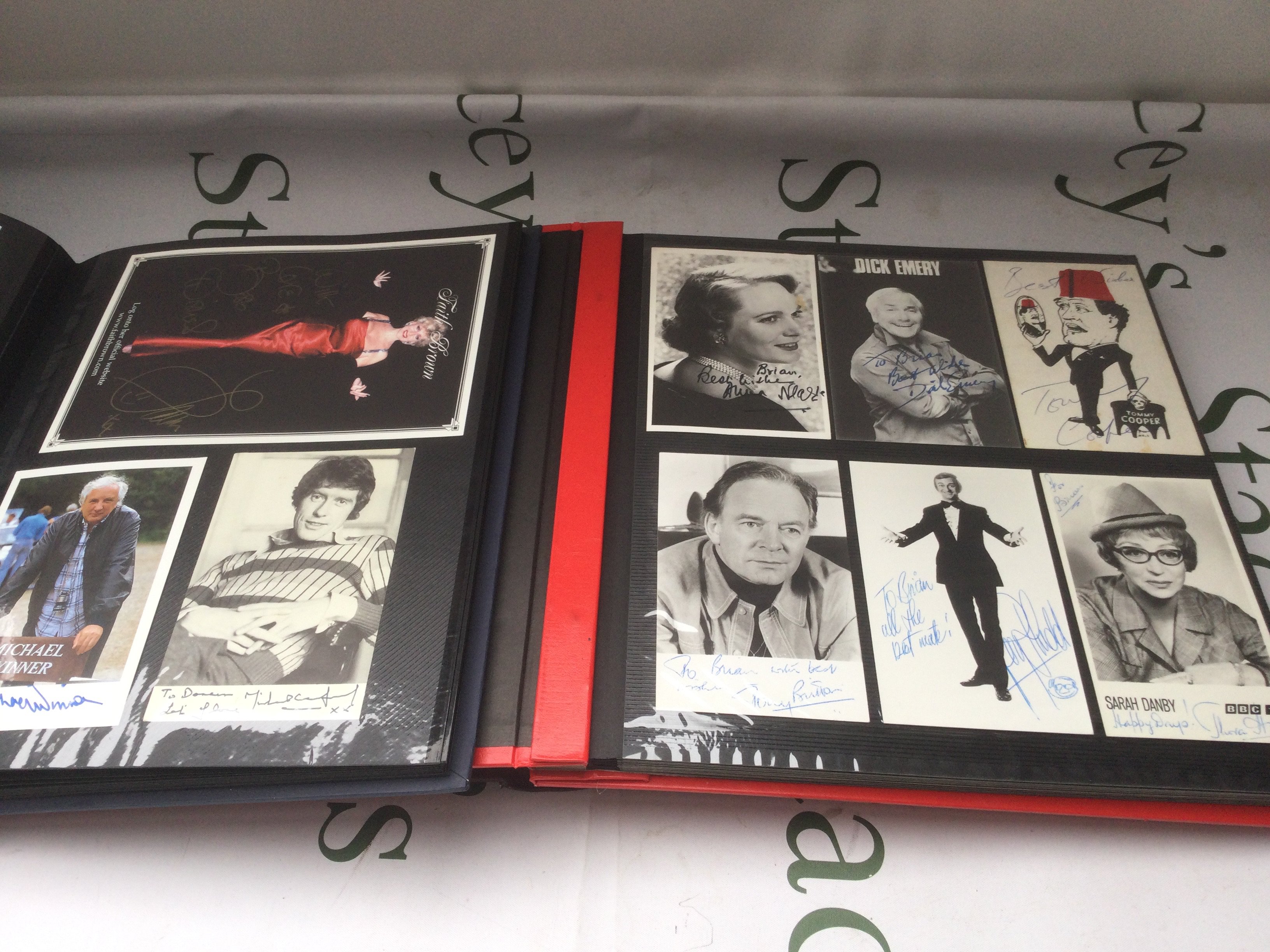 Three binders of signed photos and publicity cards comprising Tommy Cooper, Sir John Geilgud, Norman Wisdom, Eric Sykes and many more. See images for lists of contents.