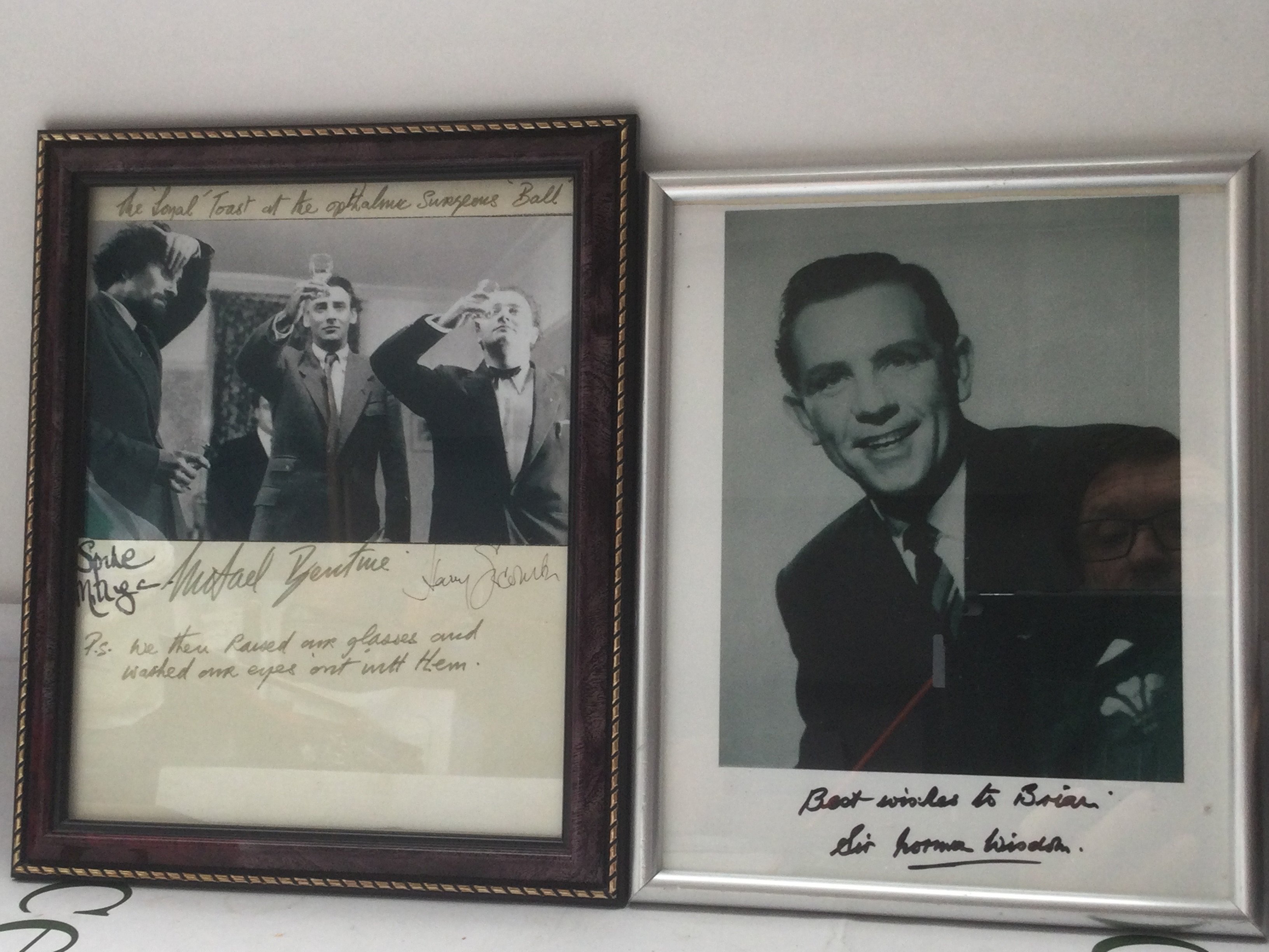 Two framed signed photos of The Goons (no Peter Sellers) and Norman Wisdom.