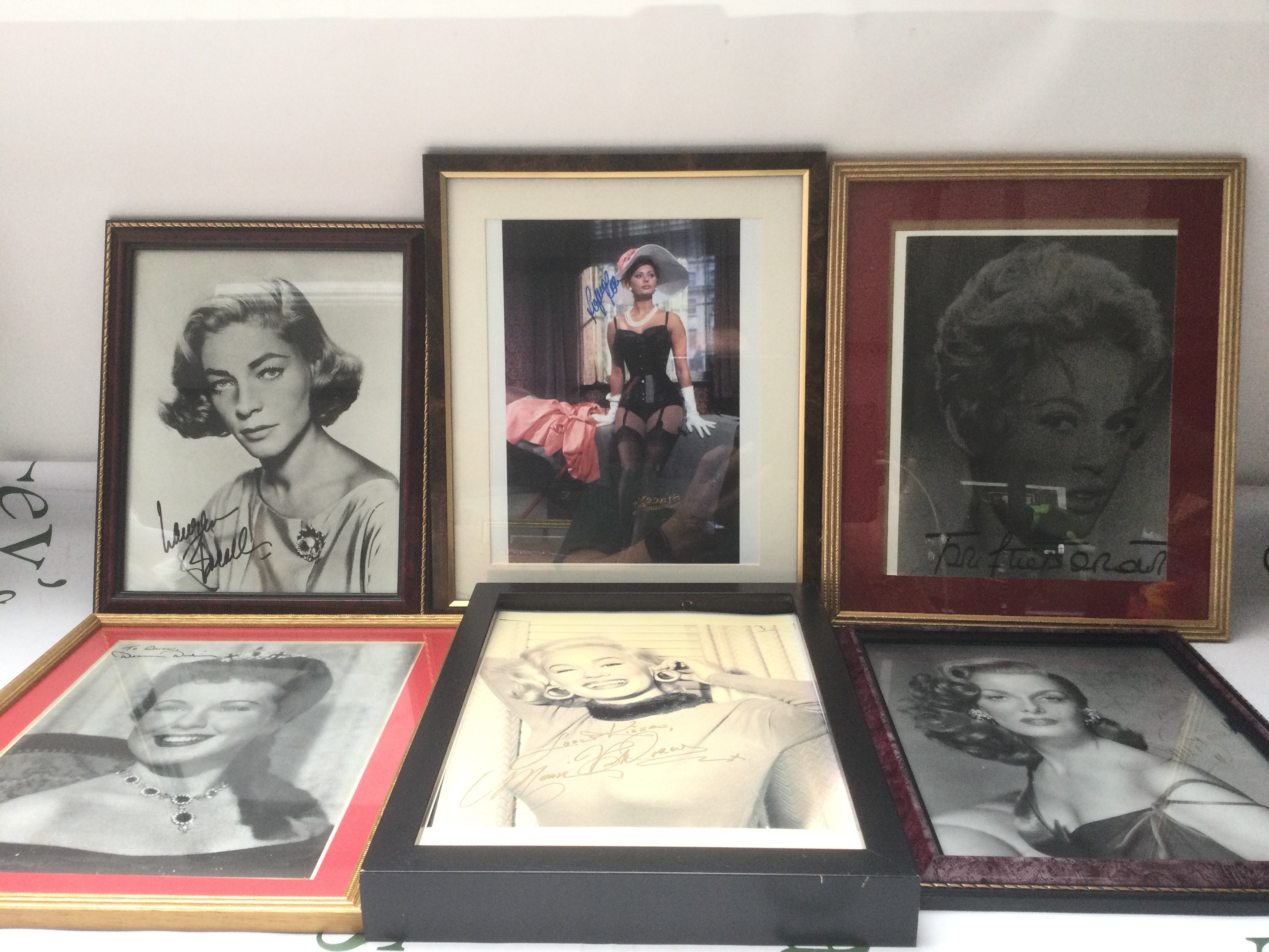 Six framed and signed photos of Sophia Loren, Jane Russell, Lauren Bacall and others.
