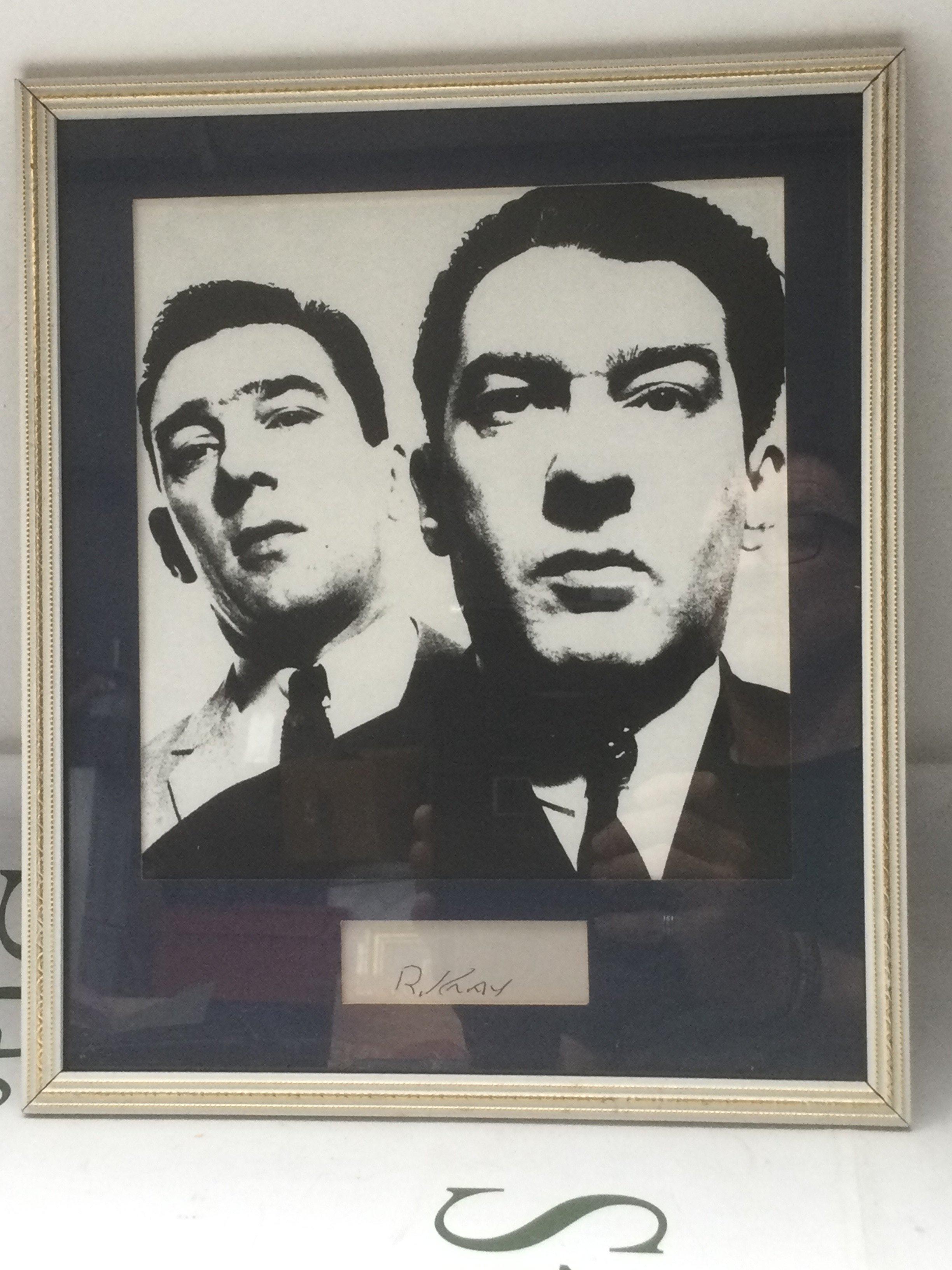A framed and glazed display of the Kray twins with Reggie Kray's autograph, approx 28cm x 33cm.