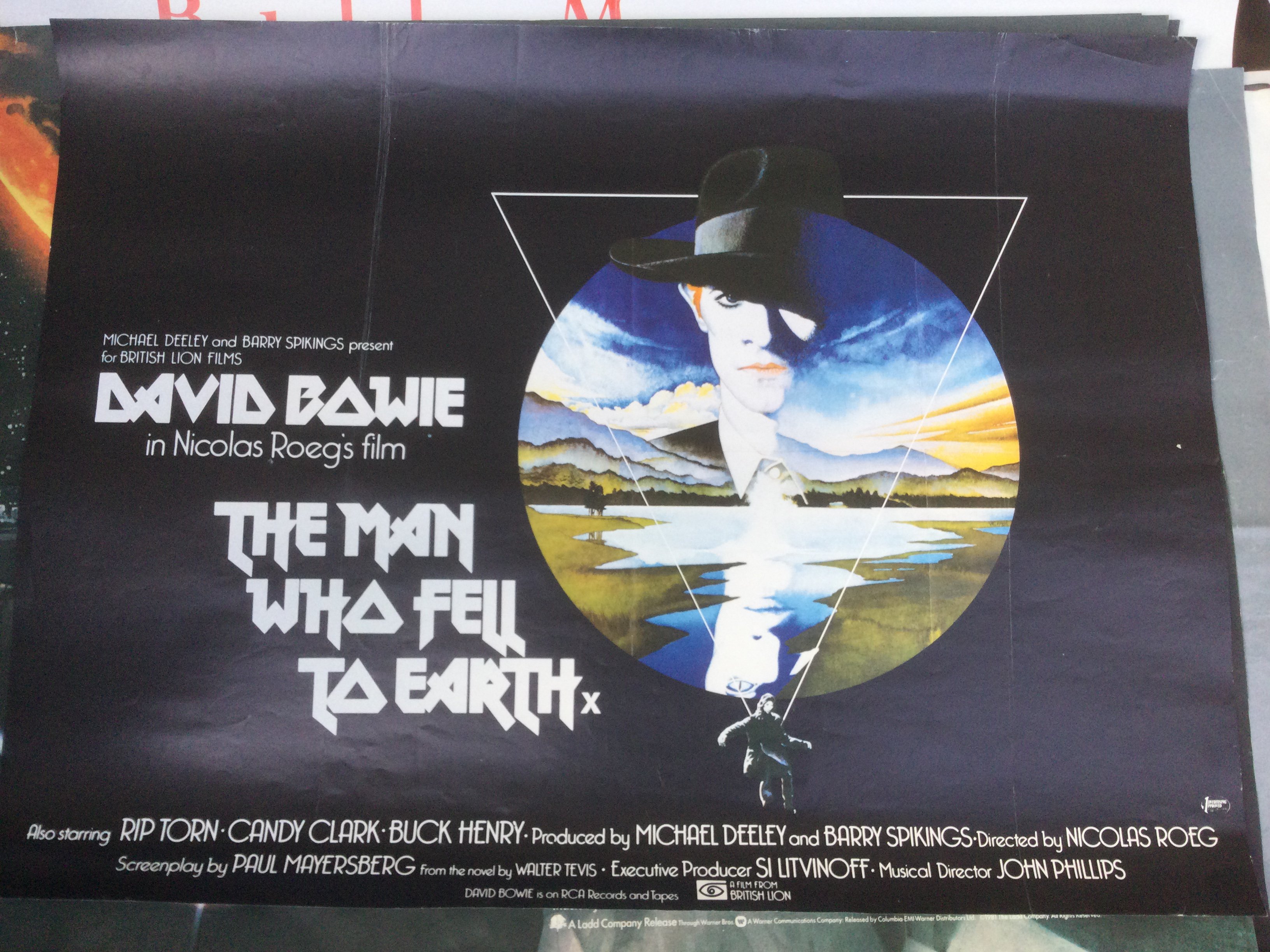 Four Uk Quad film posters comprising The Man Who Fell To Earth, a double bill of Fantastic Planet and Crystal Voyager, Mad Max Beyond Thunderdome and The Navigator. Rolled with folds.
