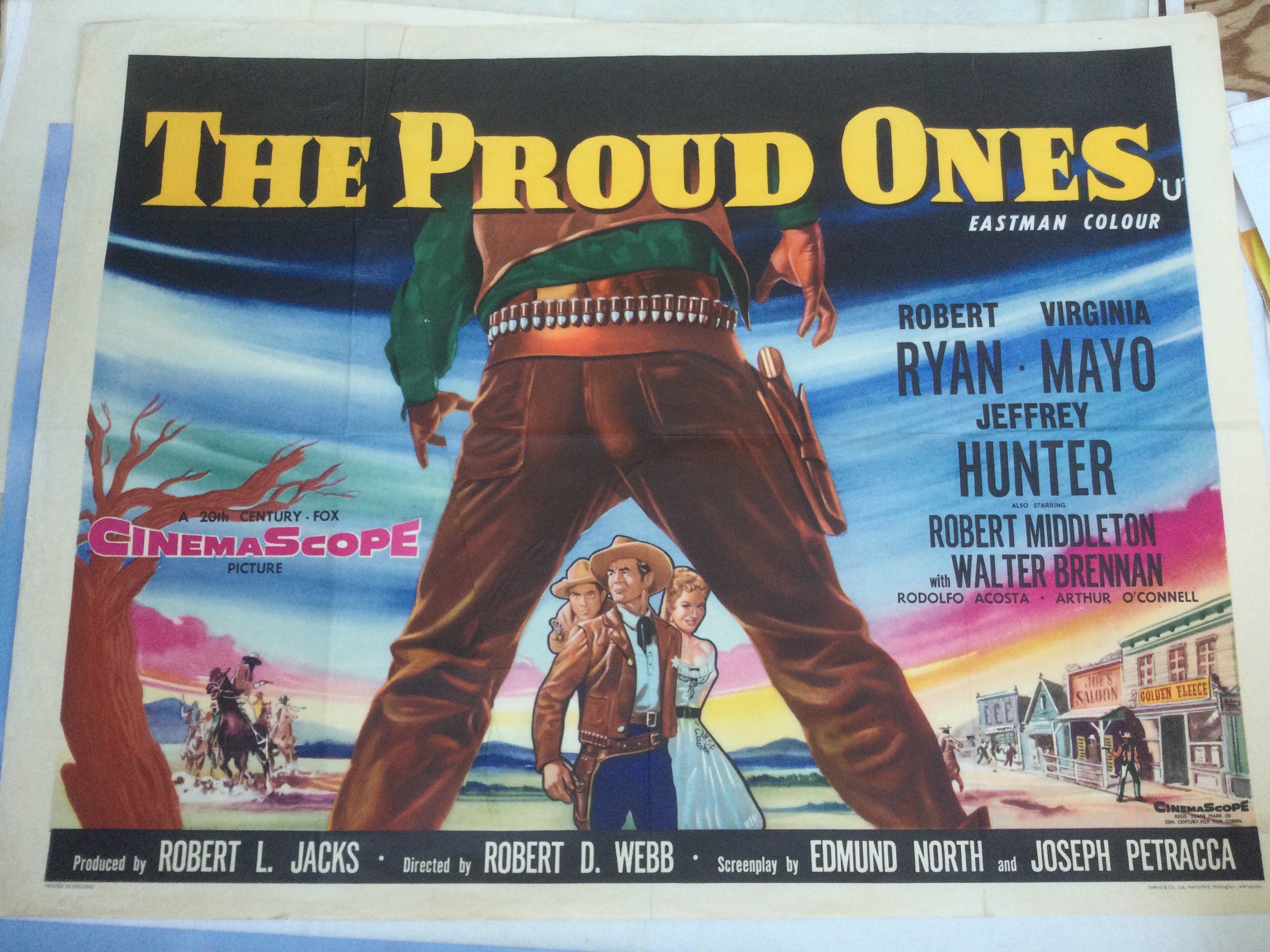 Four Western movie posters comprising two for The Proud Ones, Custer Of The West and The Spikes Gang. All folded with pin holes.