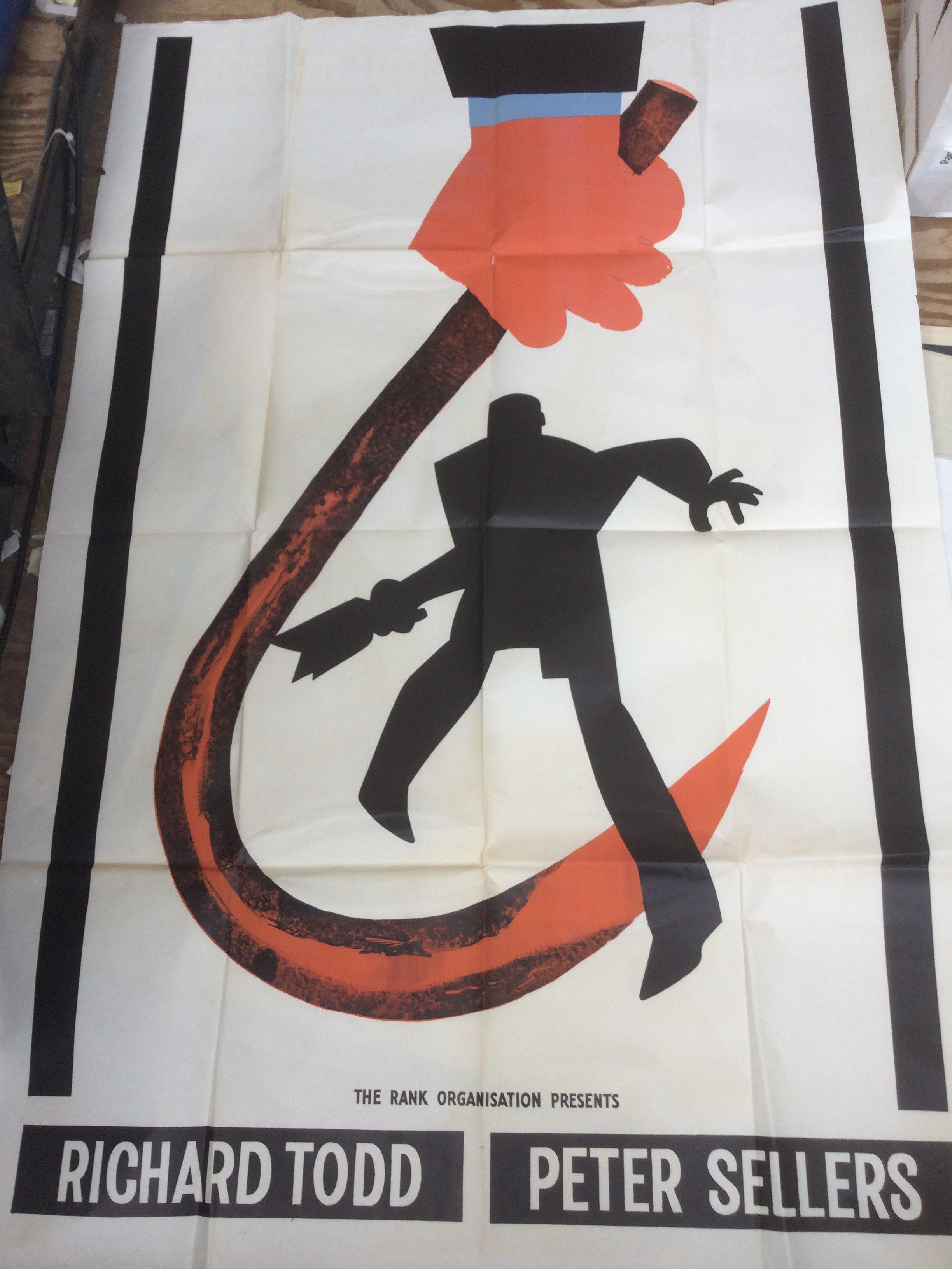 A collection of vintage film posters including various sections of billboard posters including Carve Her Name With Pride, Never Let Go and others.