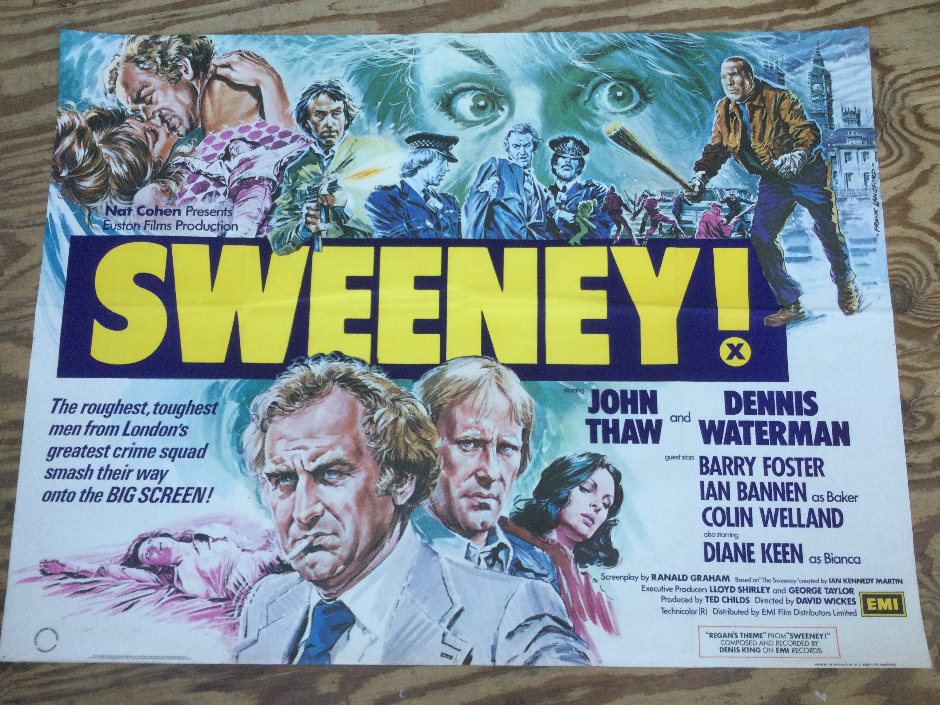 An original UK quad film poster for The Sweeney (1977), approx 101cm x 76cm. Folded with pin holes and a crease in top right corner. Someone has sadly drawn glasses on Dennis Waterman!