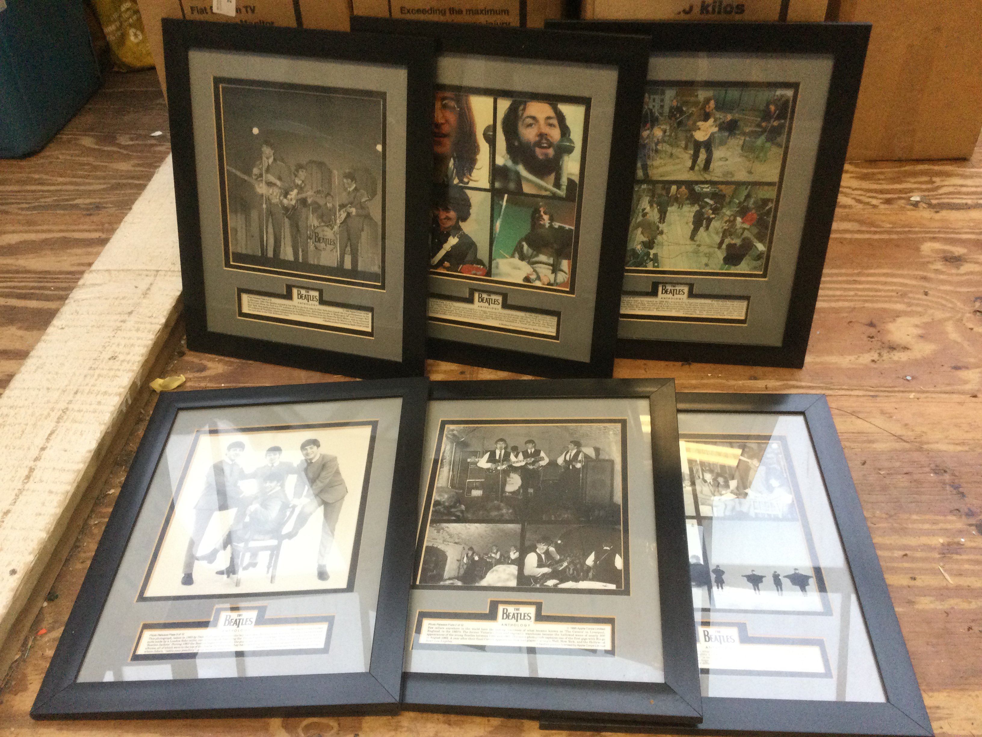 Two boxes of framed and rolled posters of The Beatles including some limited editions.