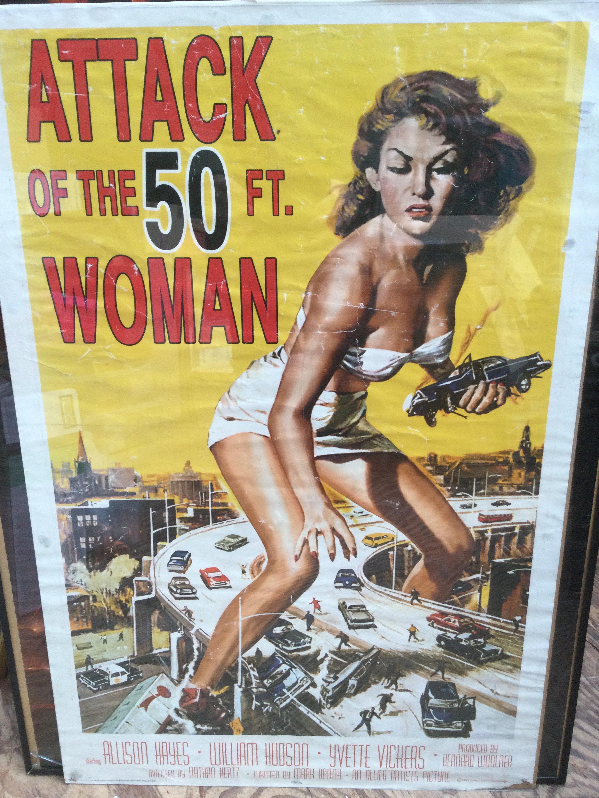 Four reproduction film posters including Indiana Jones And The Temple Of Doom, Attack Of The 50ft Woman and others plus a Jamiroquai poster (5).