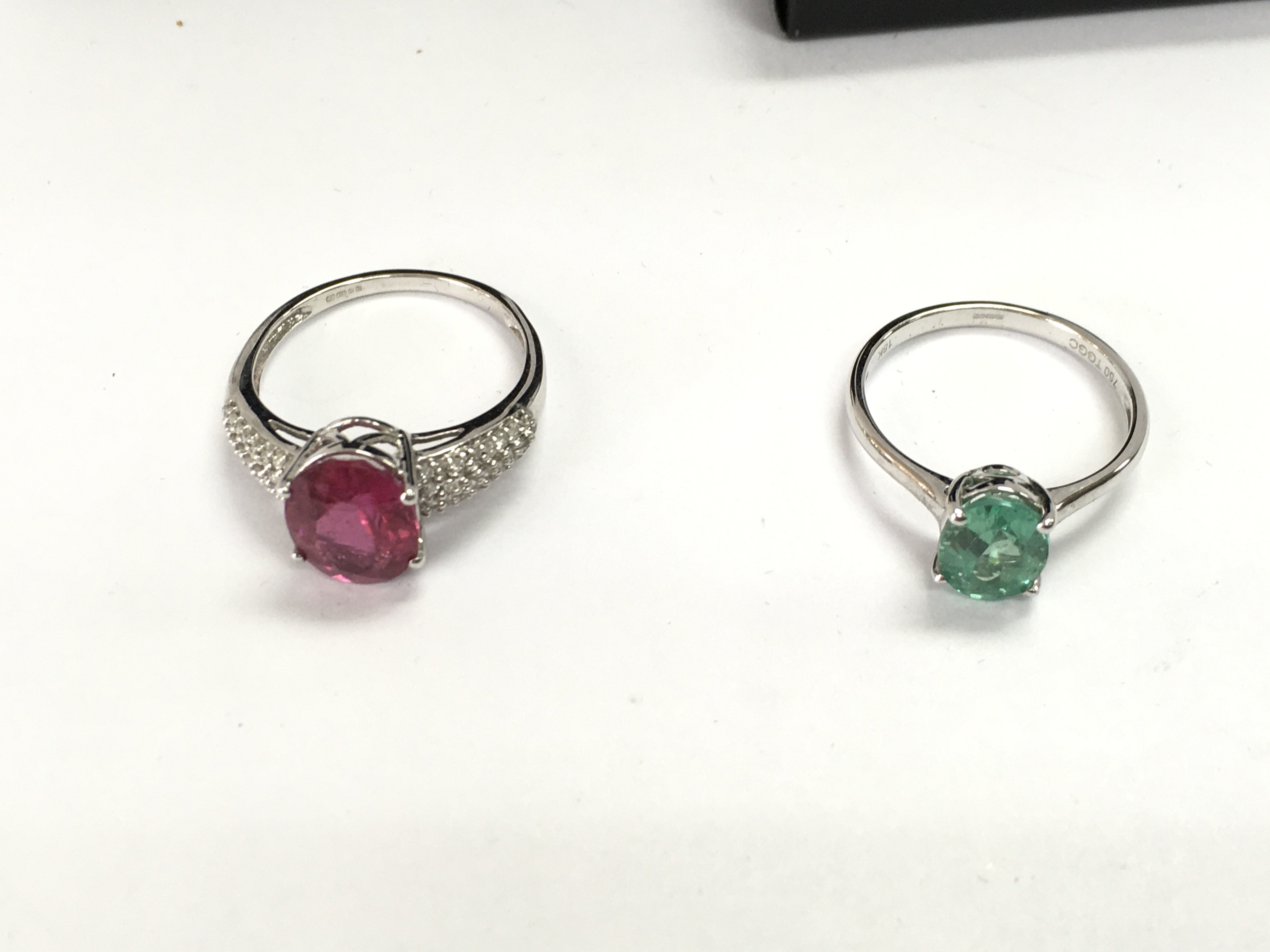 Two 18ct white gold rings set with assorted stones. 7.50g total size R 1/2 and P 1/2 Postage B