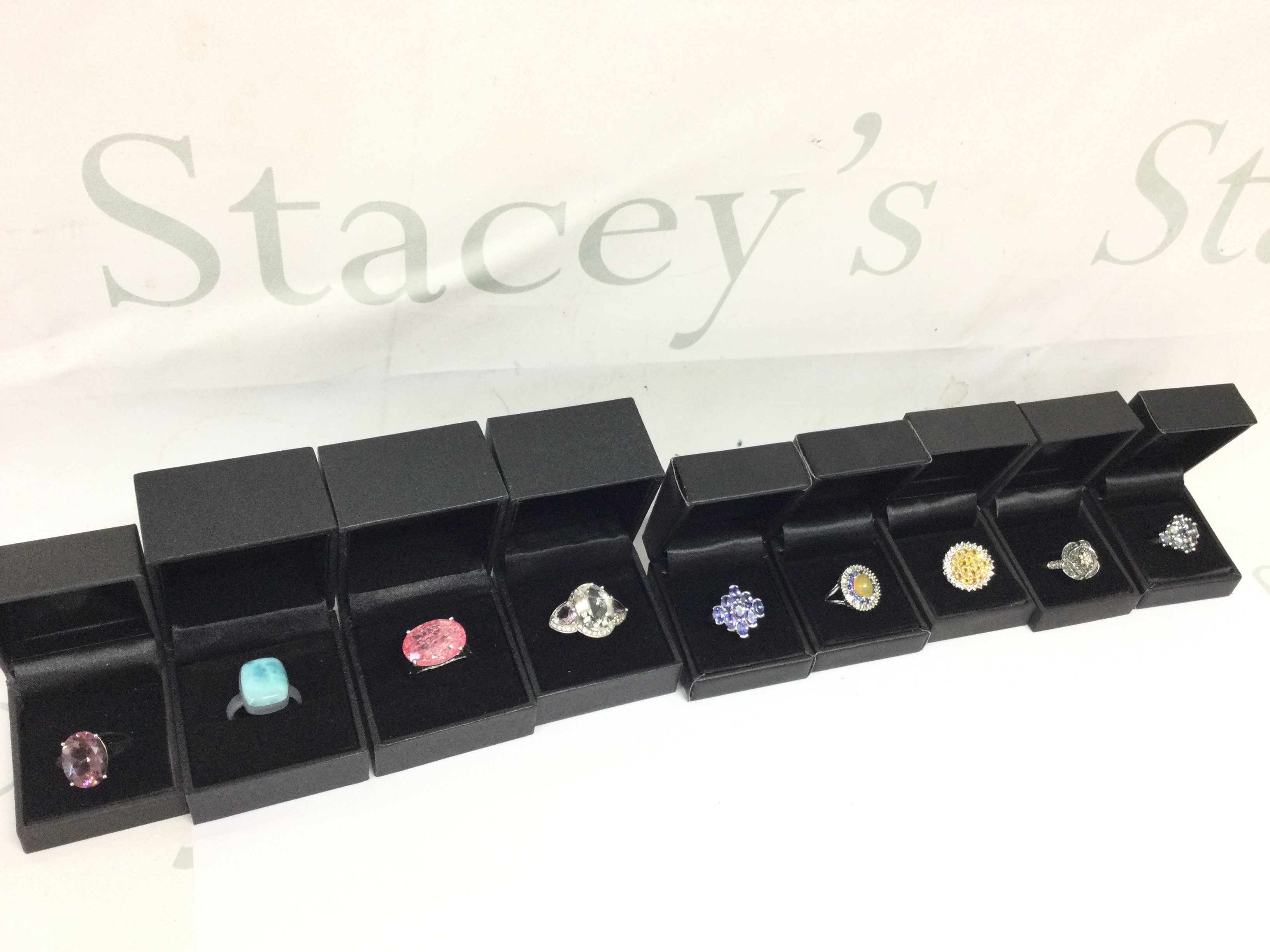 A collection of boxed silver rings set with various gemstones , average size Q. Postage category A