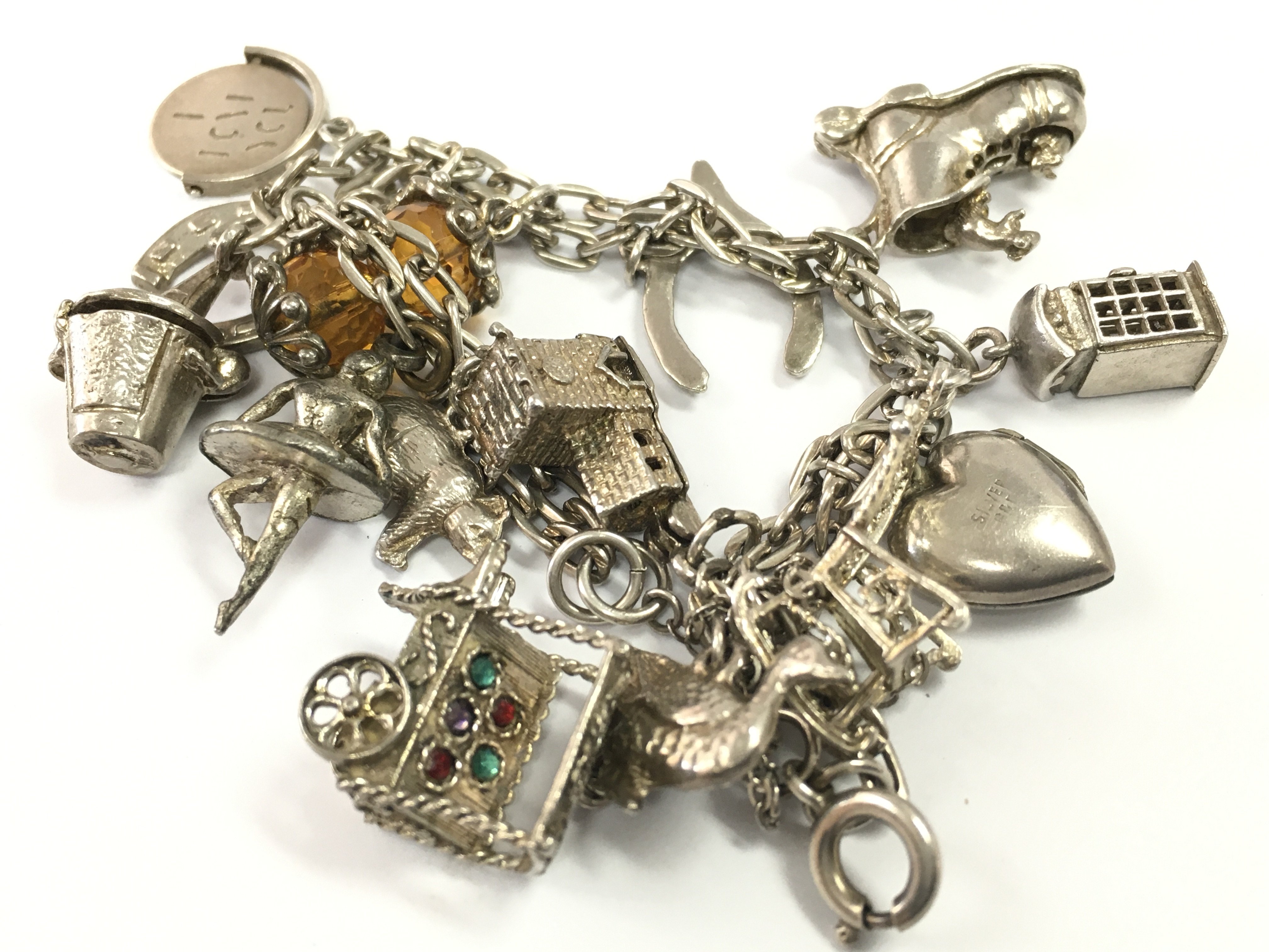 A silver charm bracelet, postage category A