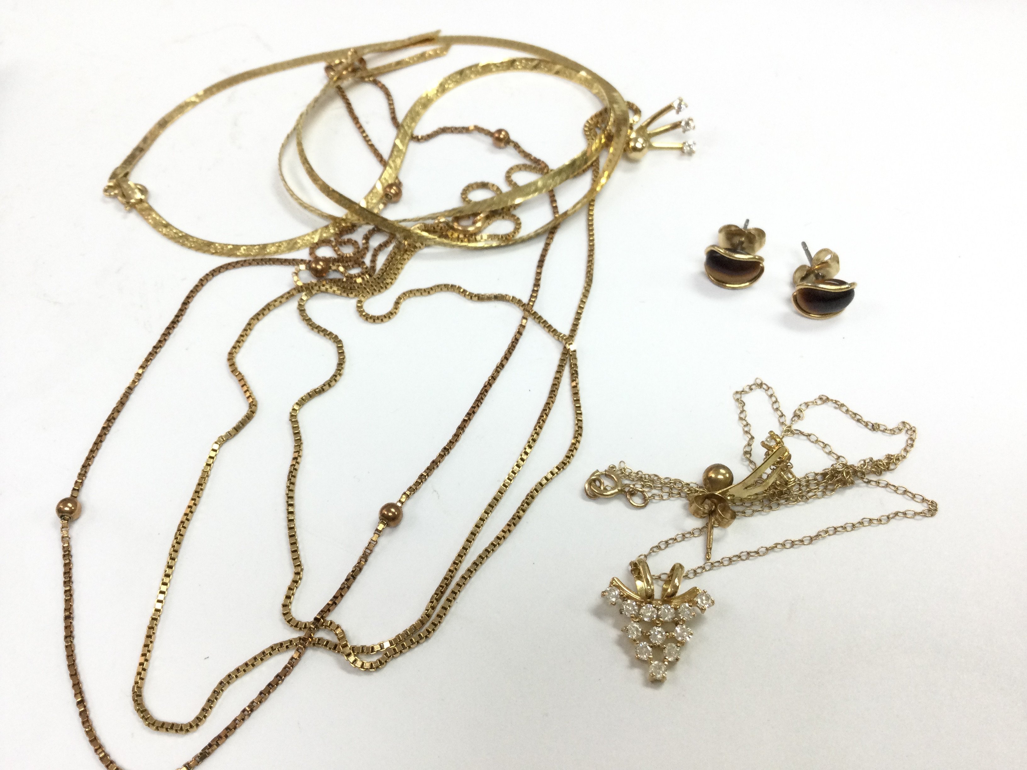 A mixed collection of 9ct gold jewellery . 14g total weight. Postage category A