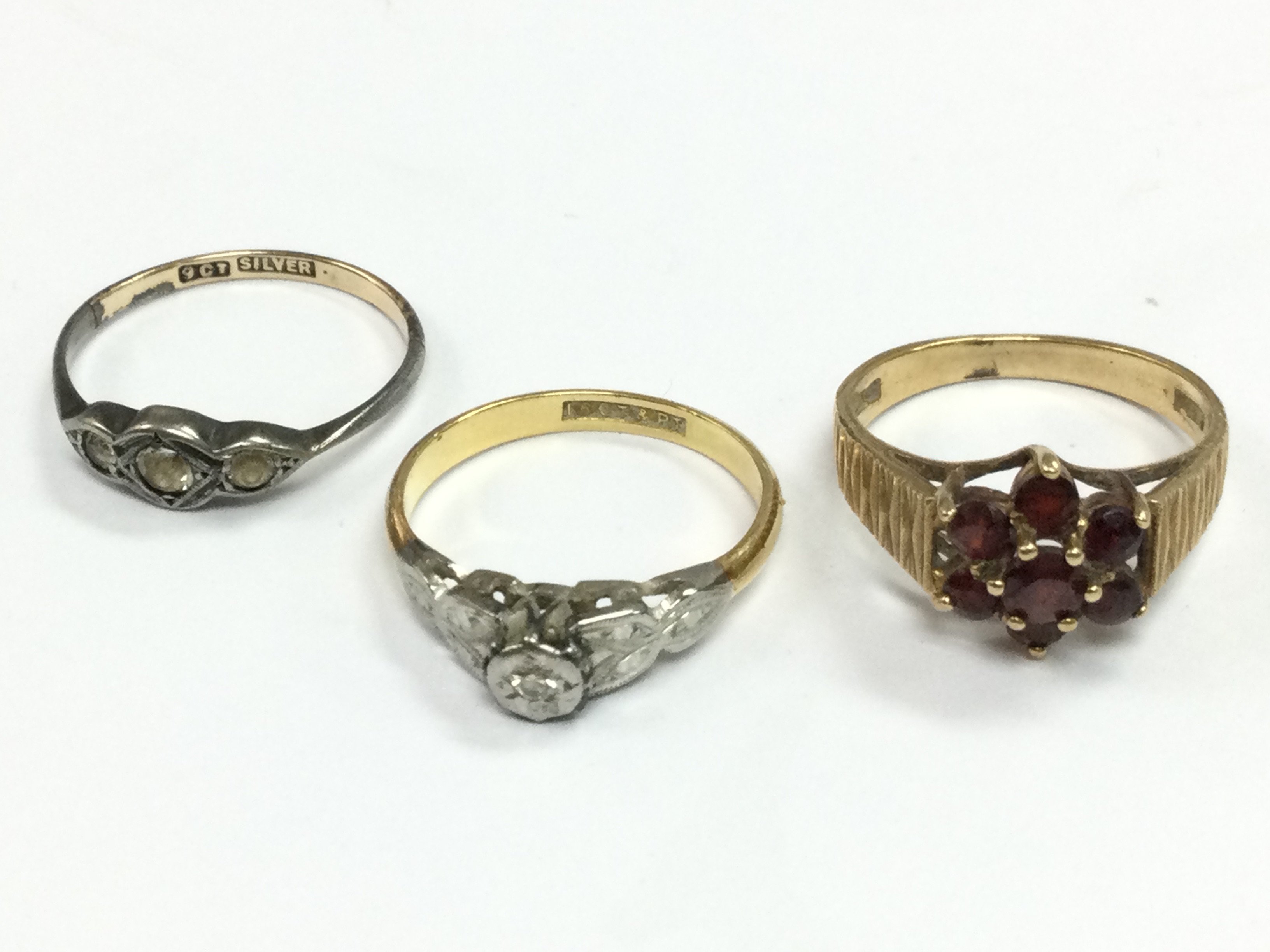 9ct, 18ct gold and platinum , 9ct and silver gold rings. 6.2g total weight . Postage category A