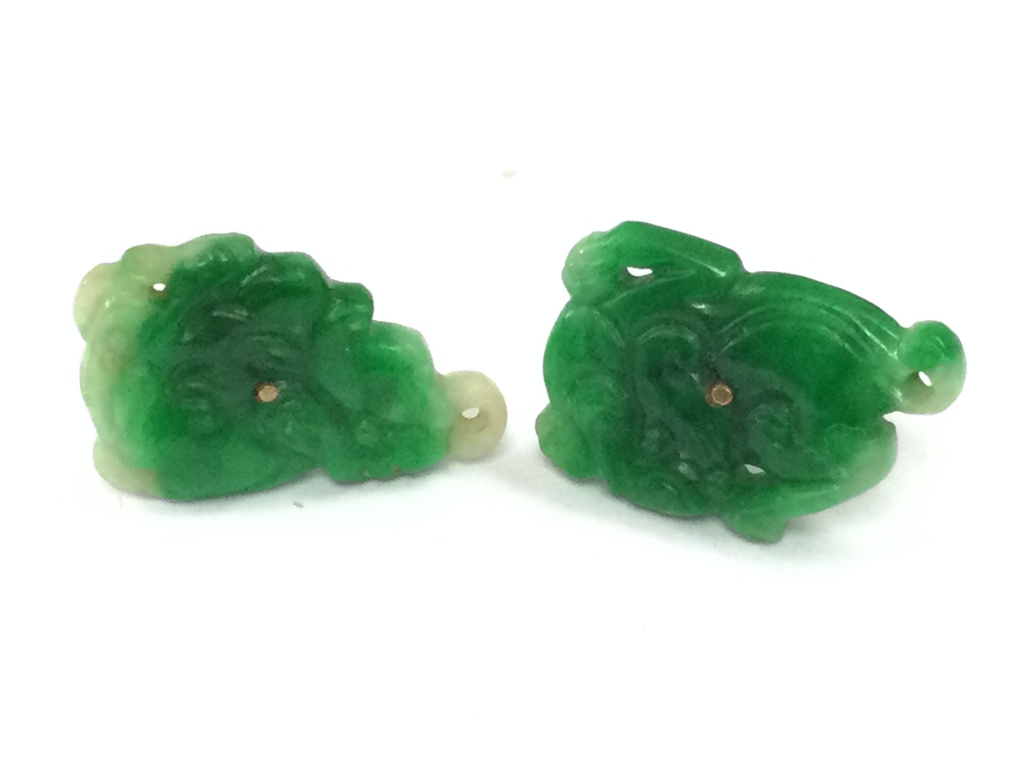A pair of 9ct gold mounted jade studs . 3.6g total weight. Postage category A