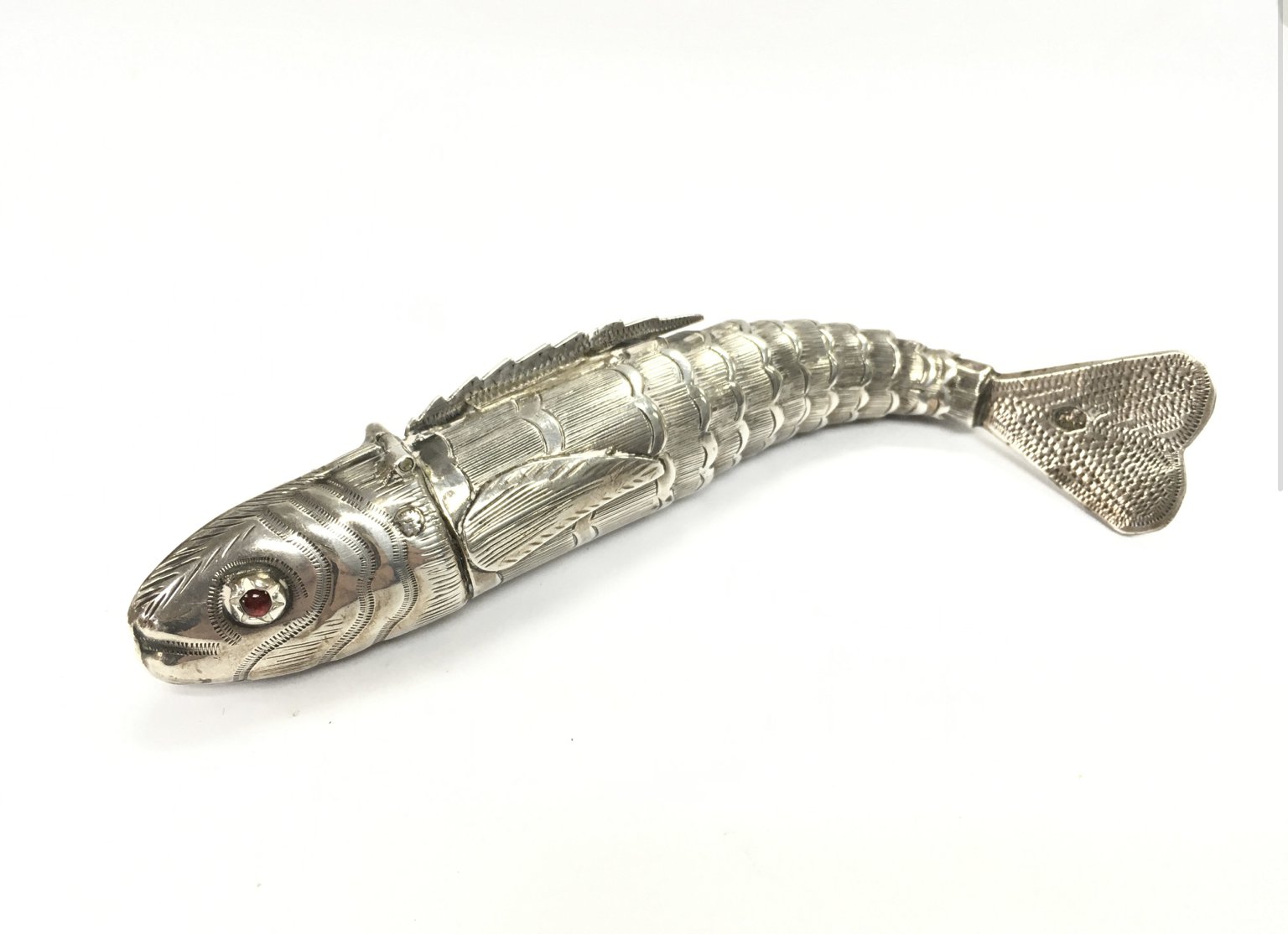 An articulated silver fish vinaigrette . 13cm long Postage category A