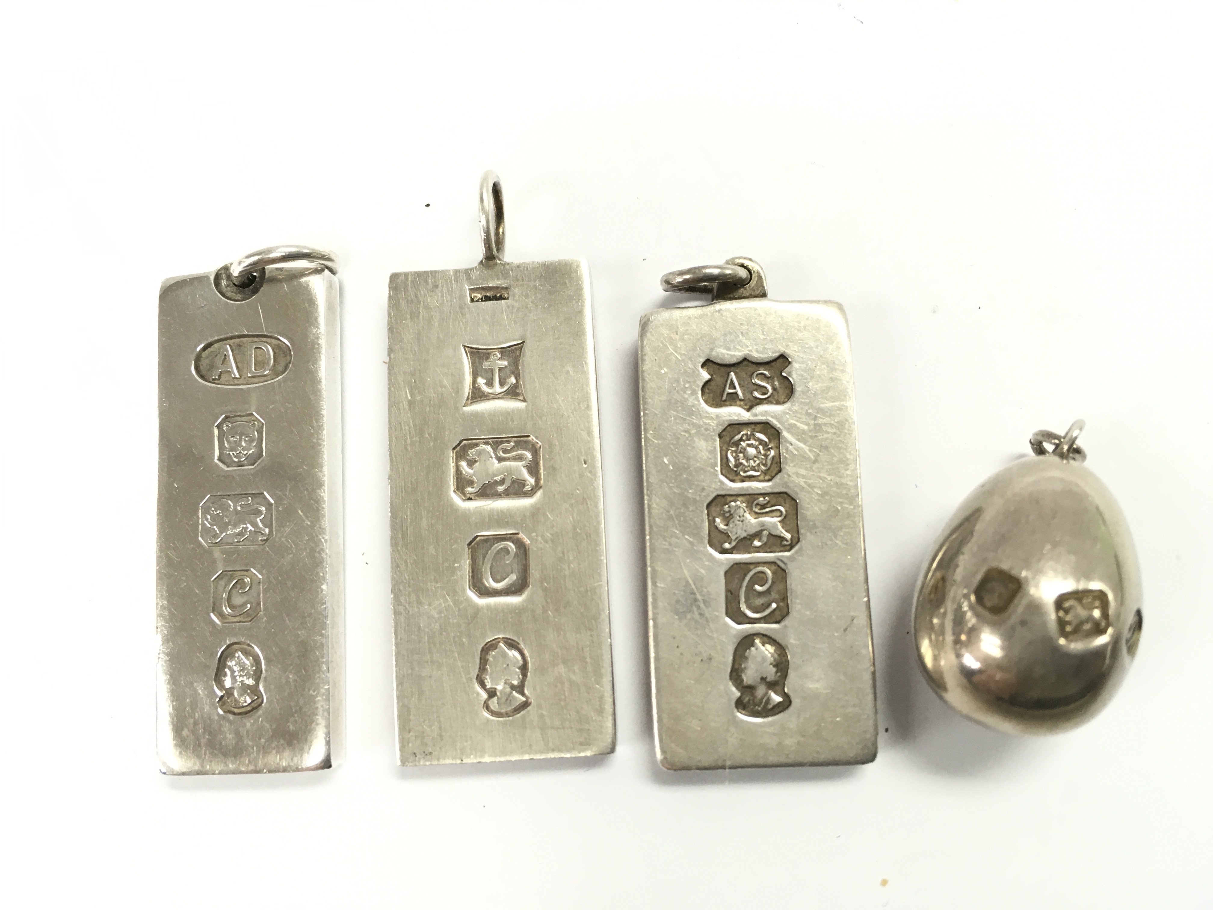 Four silver hallmarked ingot pendants , Approx 120g postage category A