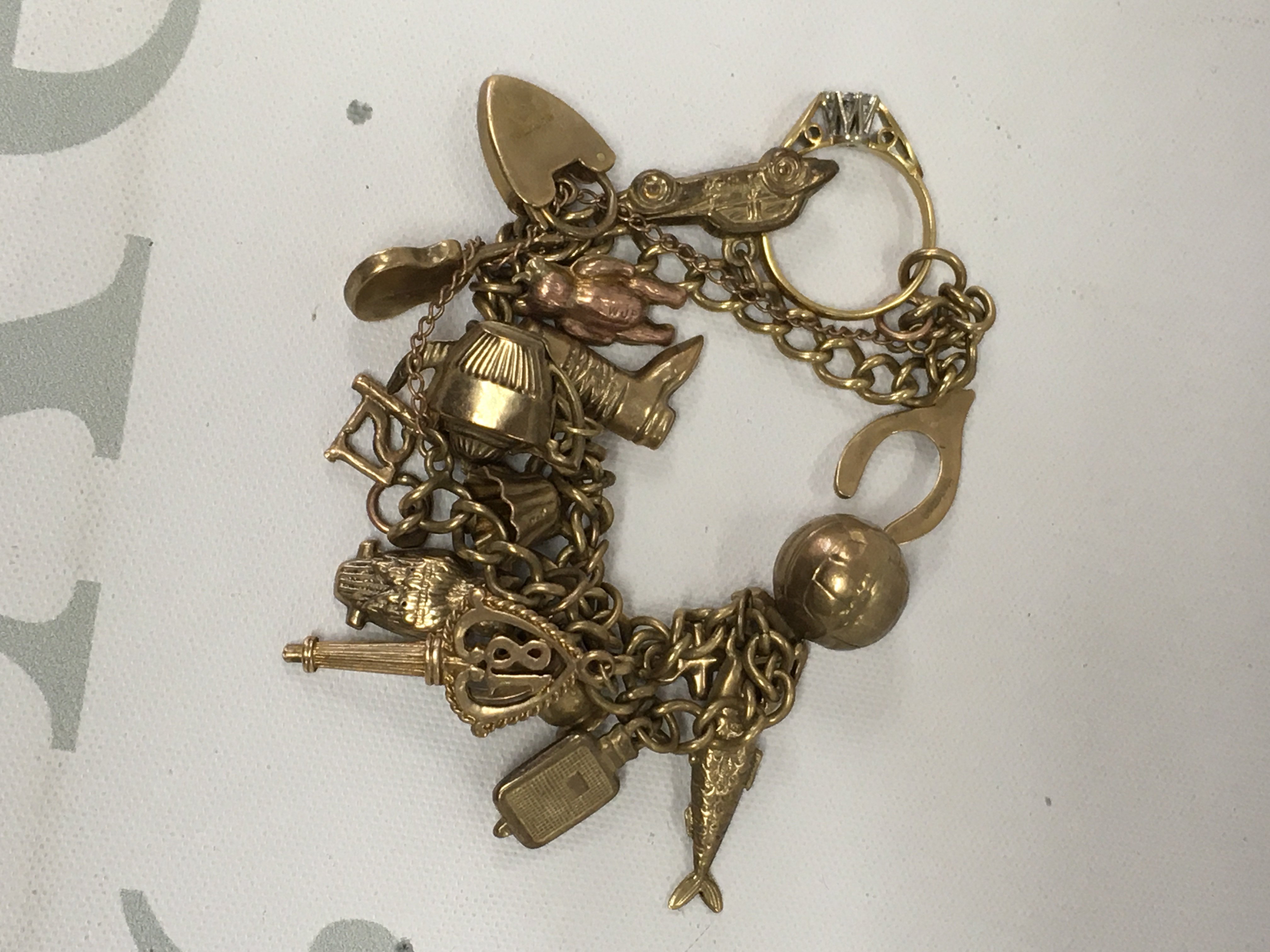 A 9 ct gold charm bracelet 20.5 grams.