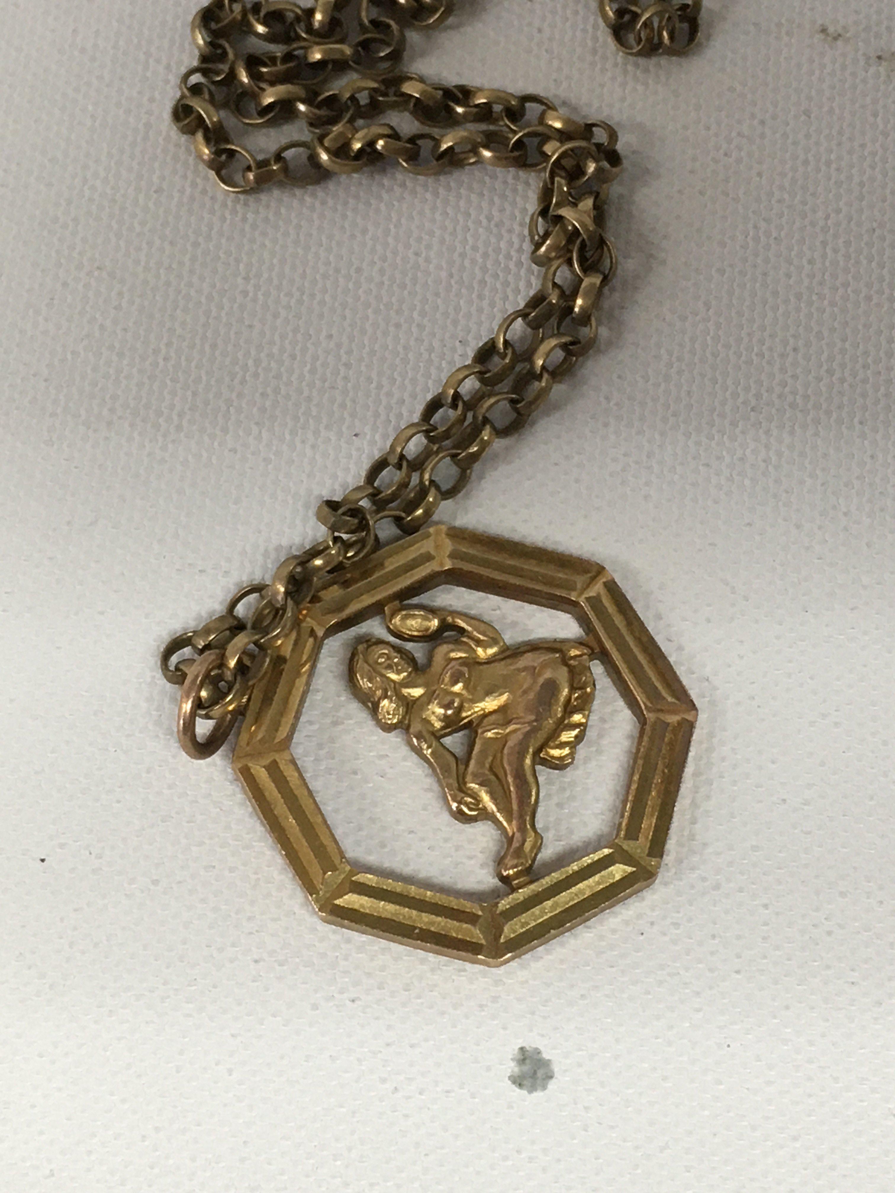 A 9 ct gold pendant and chain 9 grams.