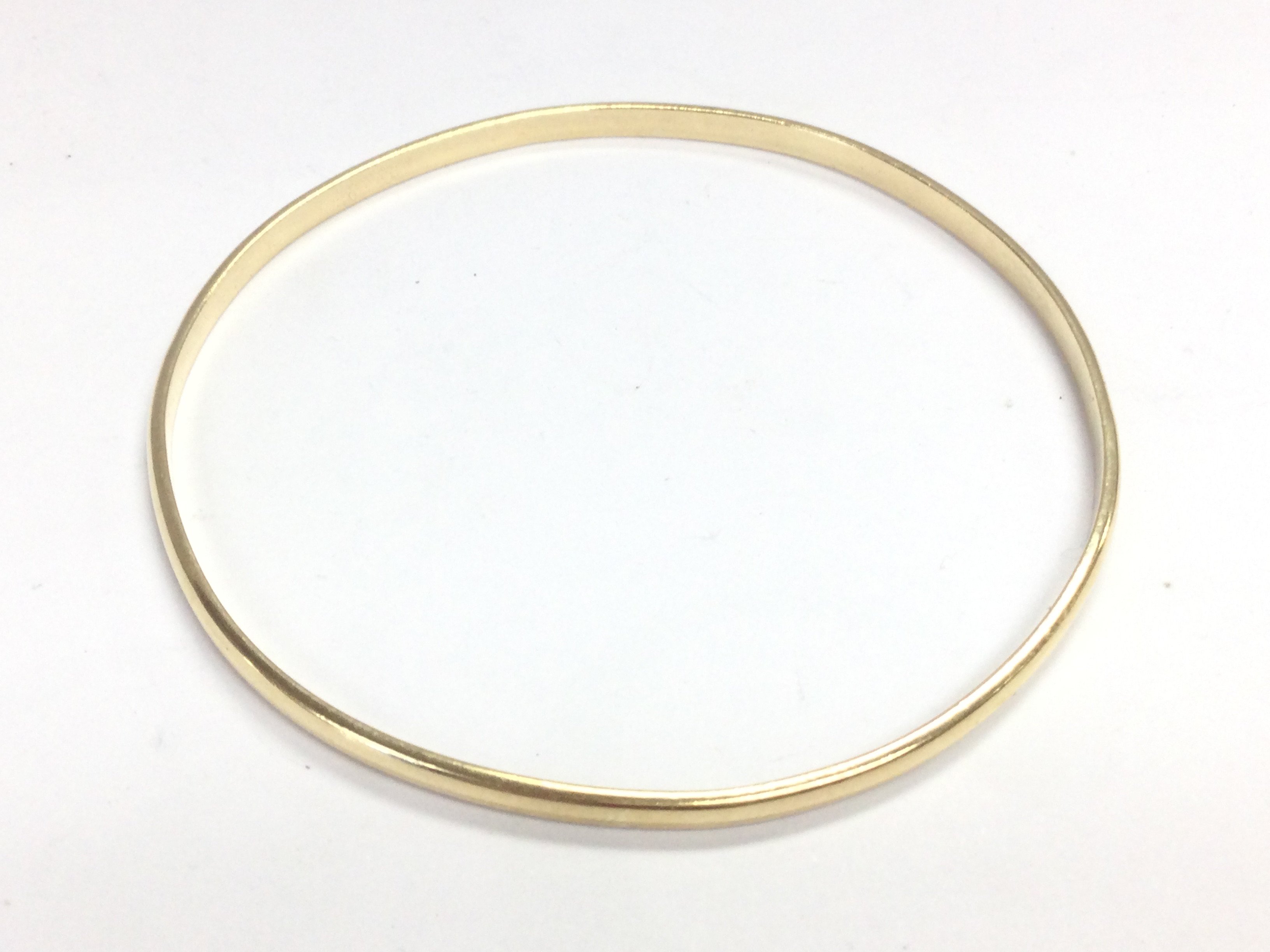 A 9ct gold bangle , 8g total weight approximately . Postage category A