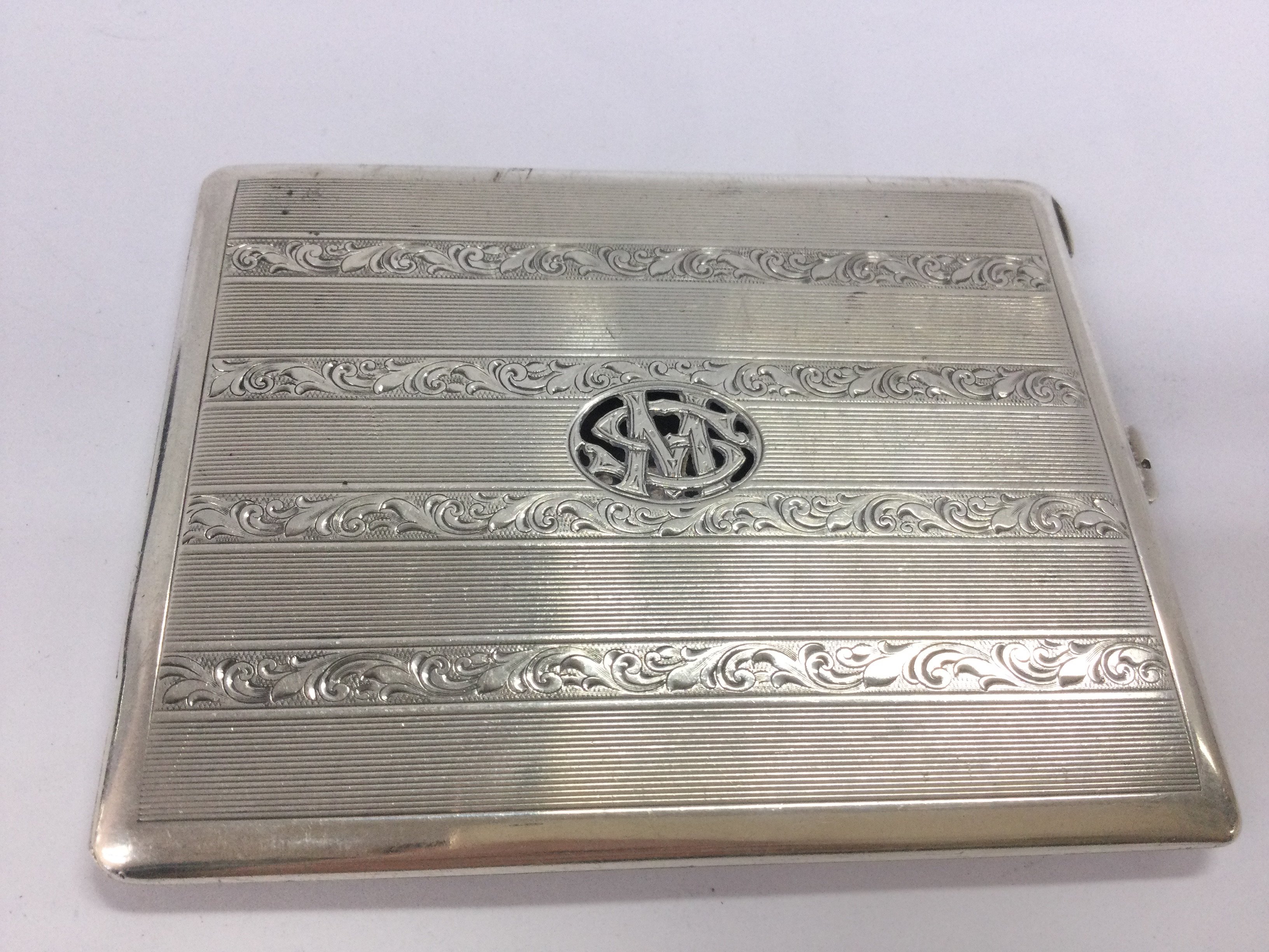 A silver cigarette case, made in Austria marked 935. Postage cat A