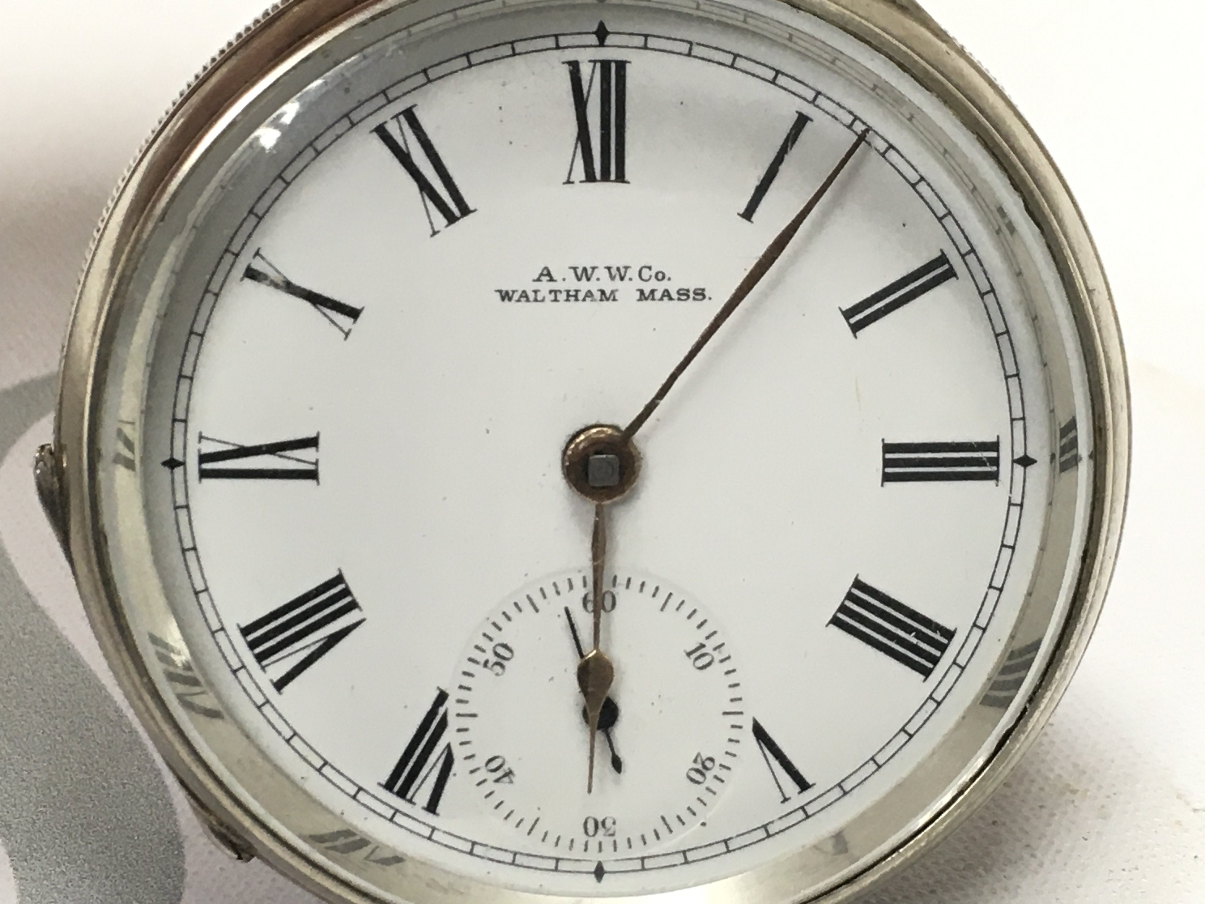 A silver waltham pocket watch, seen working , postage category B