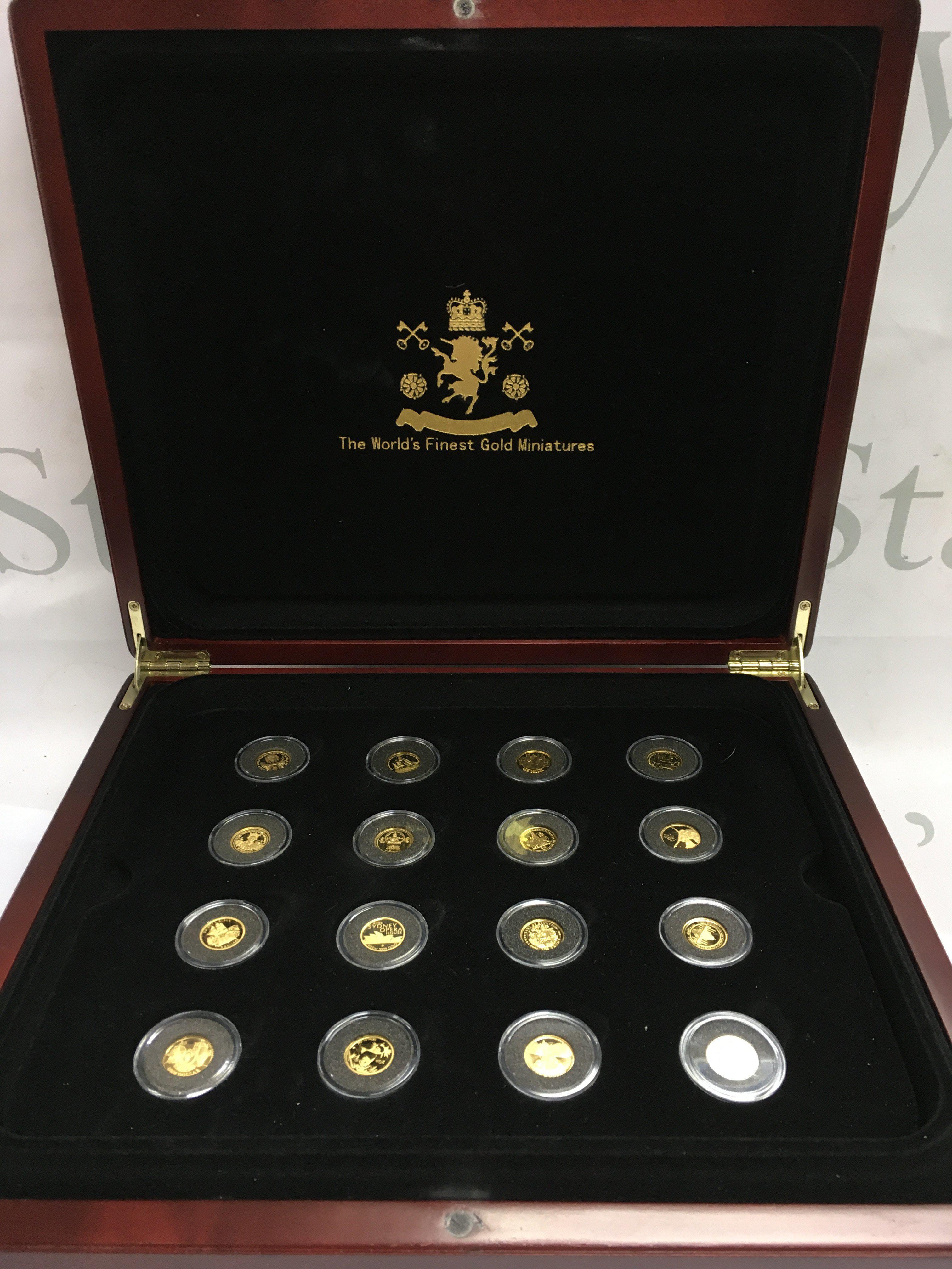 A cased set of The Worlds Finest Gold Miniatures Geoffrey Howard issue with 16 gold miniatures , approximately 1.2/1.3g per coin . With certification booklet. Postage category B
